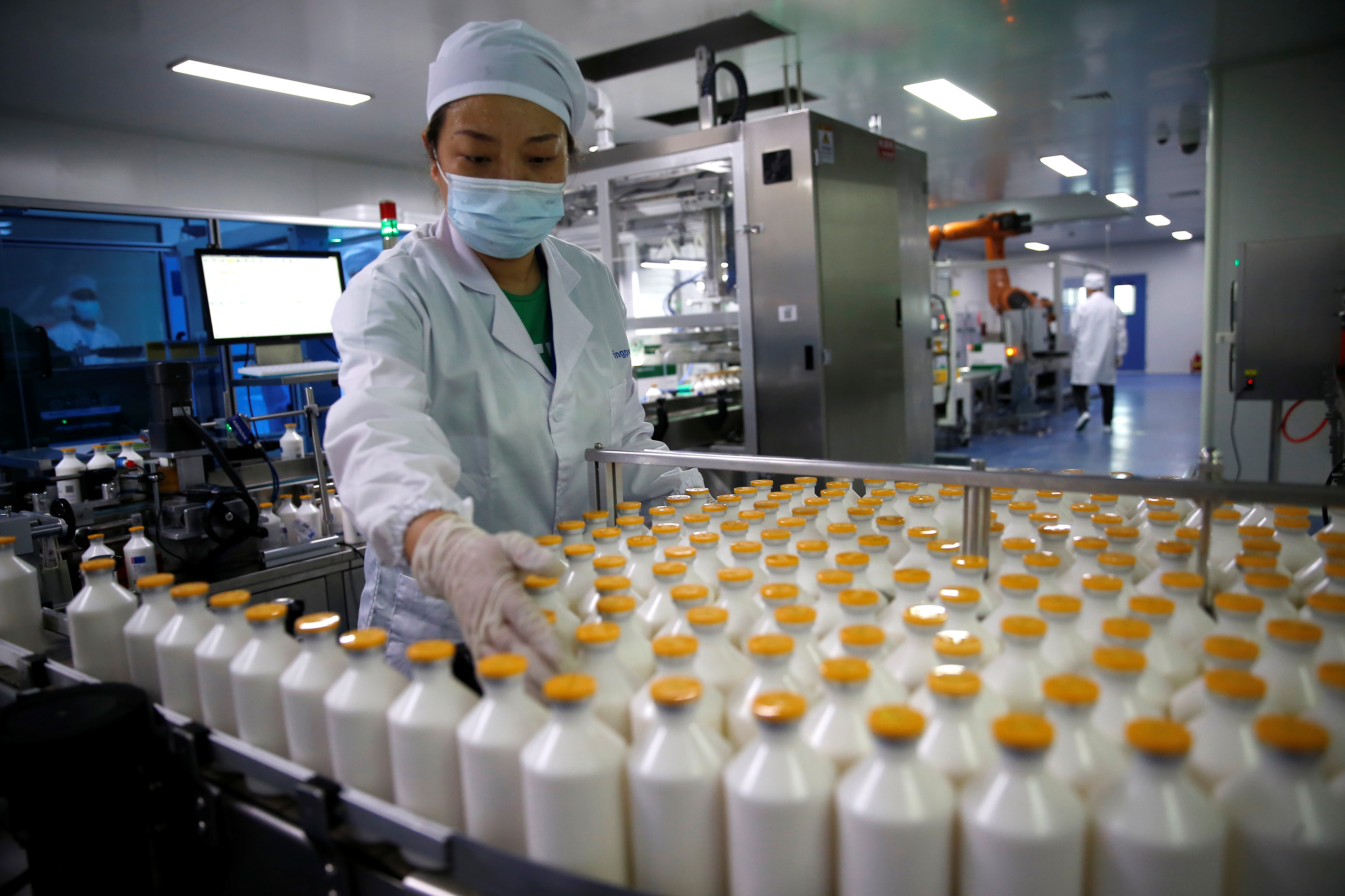 An employee works at a packaging line at Ringpu Biotech in Tianjin