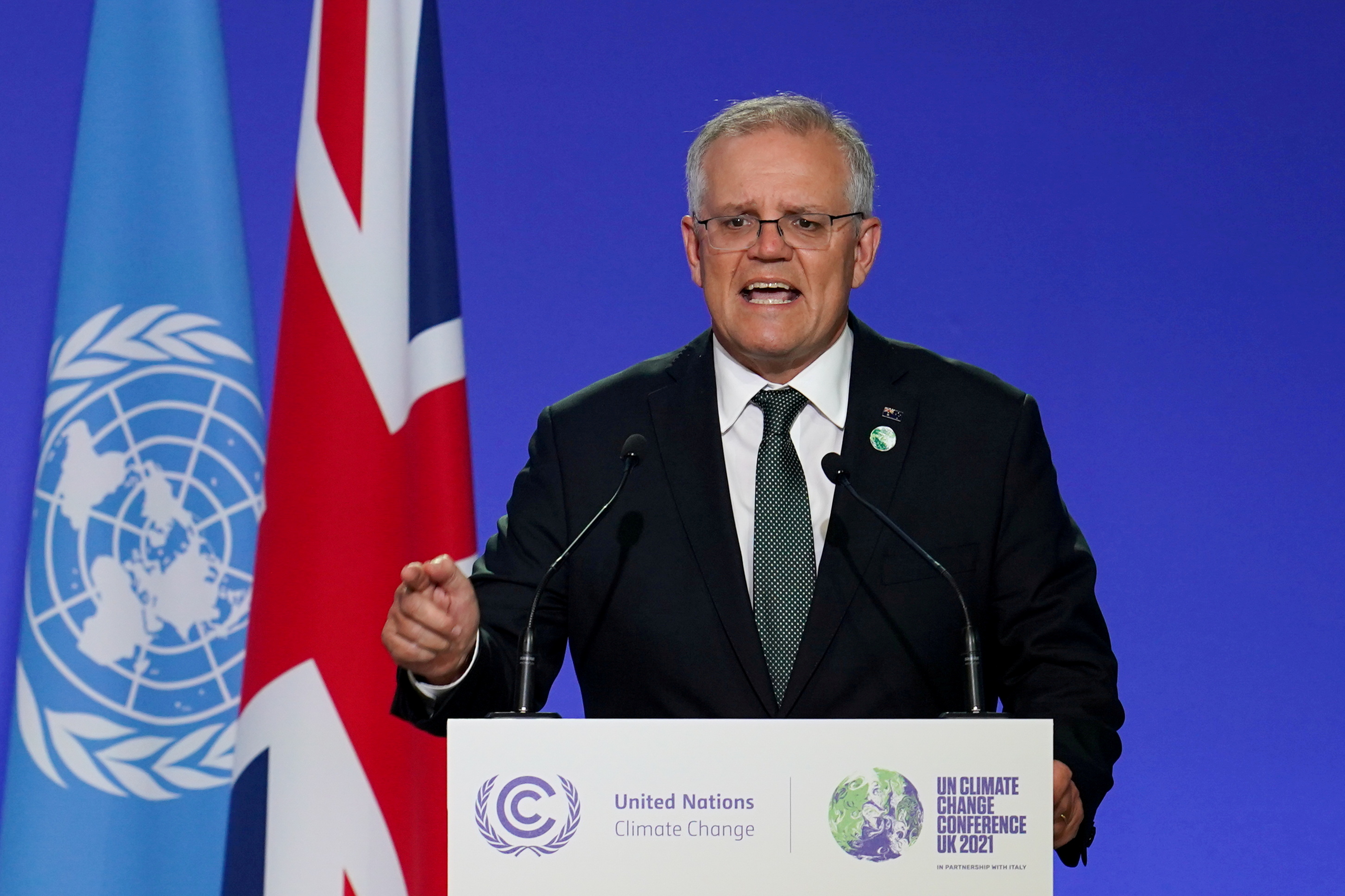 FILE PHOTO: Australia's Prime Minister Scott Morrison speaks as National Statements are delivered as a part of the World Leaders' Summit at the UN Climate Change Conference (COP26) in Glasgow, Scotland, Britain November 1, 2021. Ian Forsyth/Pool via REUTERS/File Photo