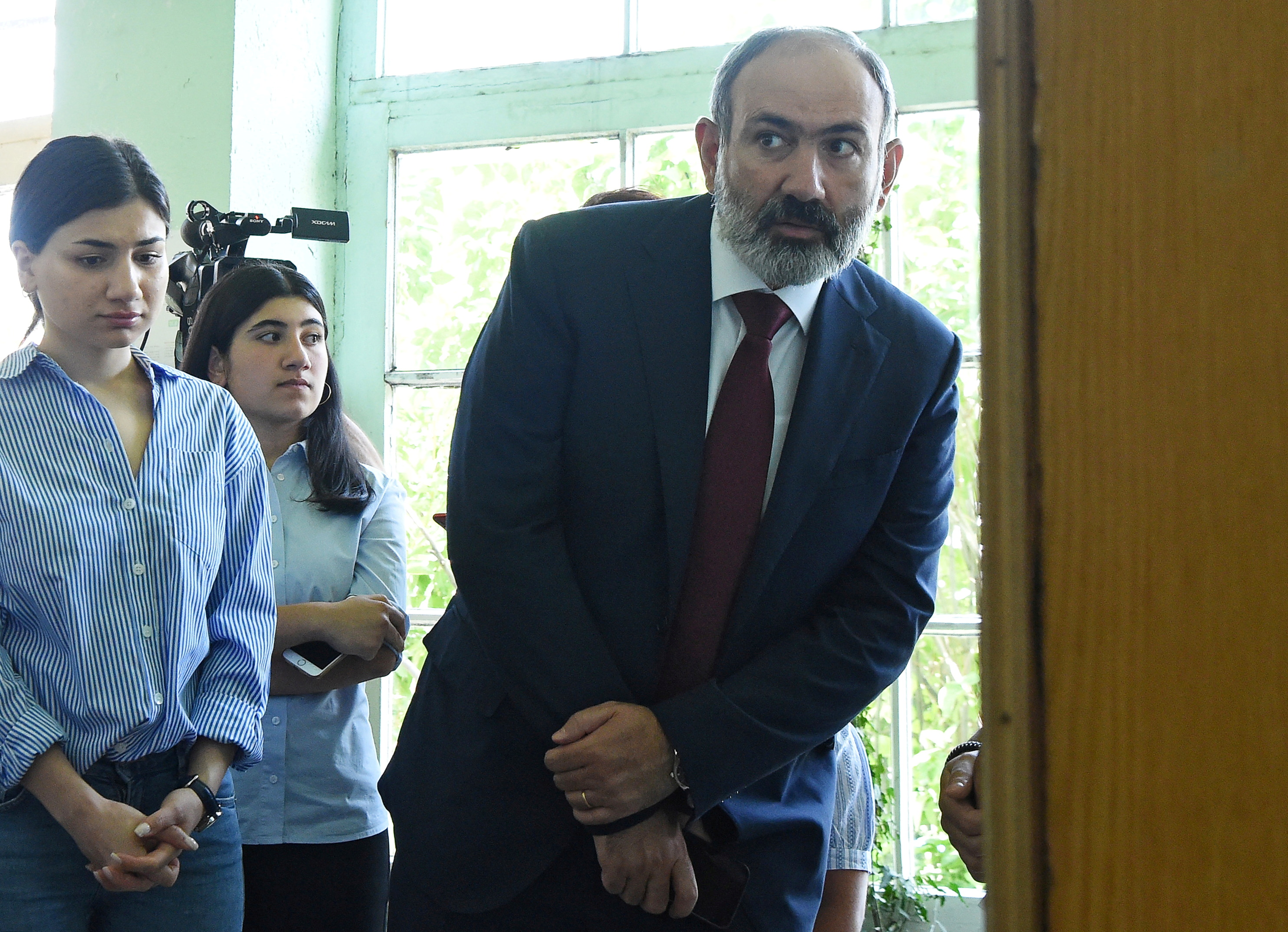 Armenia's acting Prime Minister and leader of Civil Contract party Nikol Pashinyan visits a polling station to cast his vote during the snap parliamentary election in Yerevan, Armenia June 20, 2021. Lusi Sargsyan/Photolure via REUTERS
