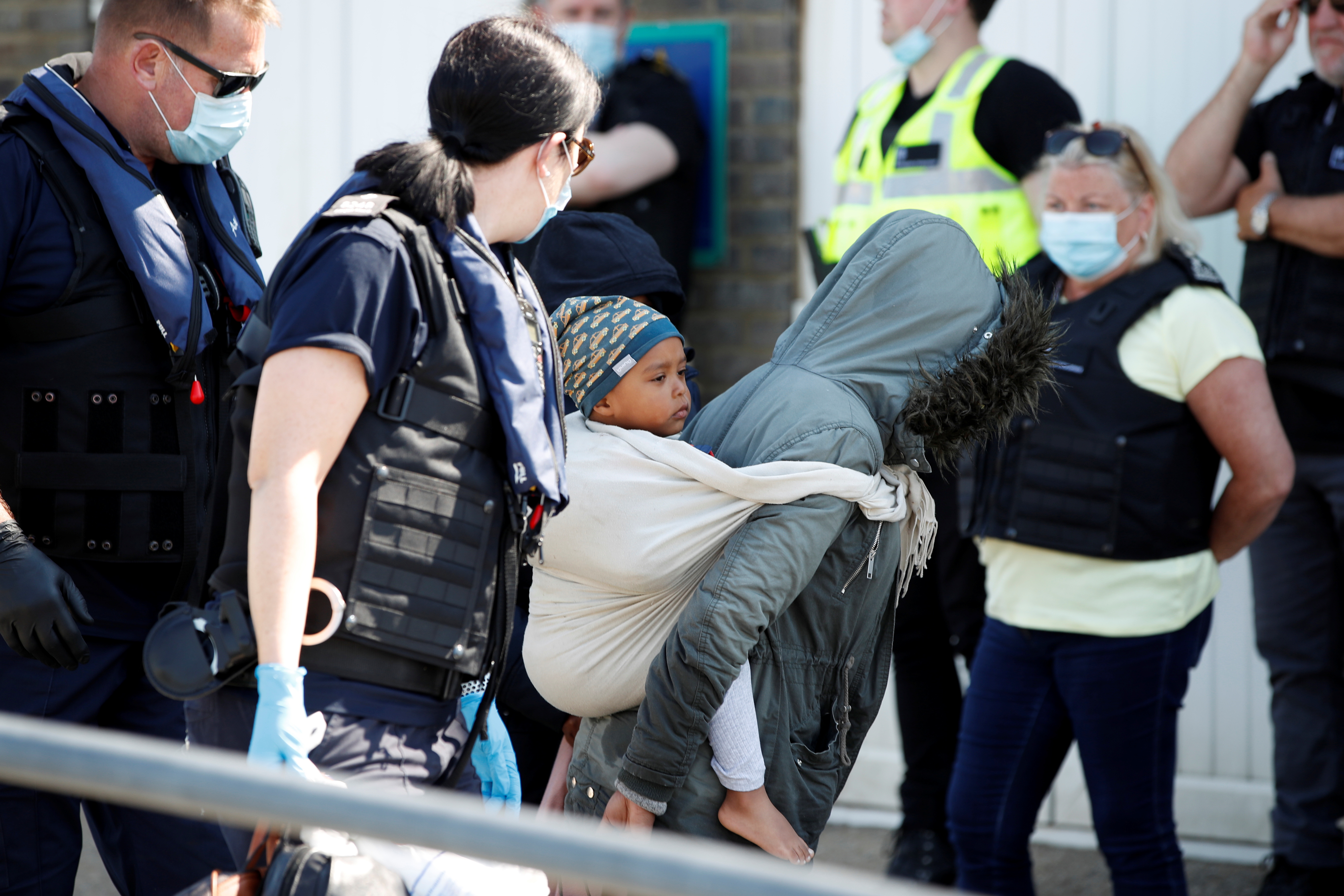 Migrants are brought into Dover Harbour by British Border Force