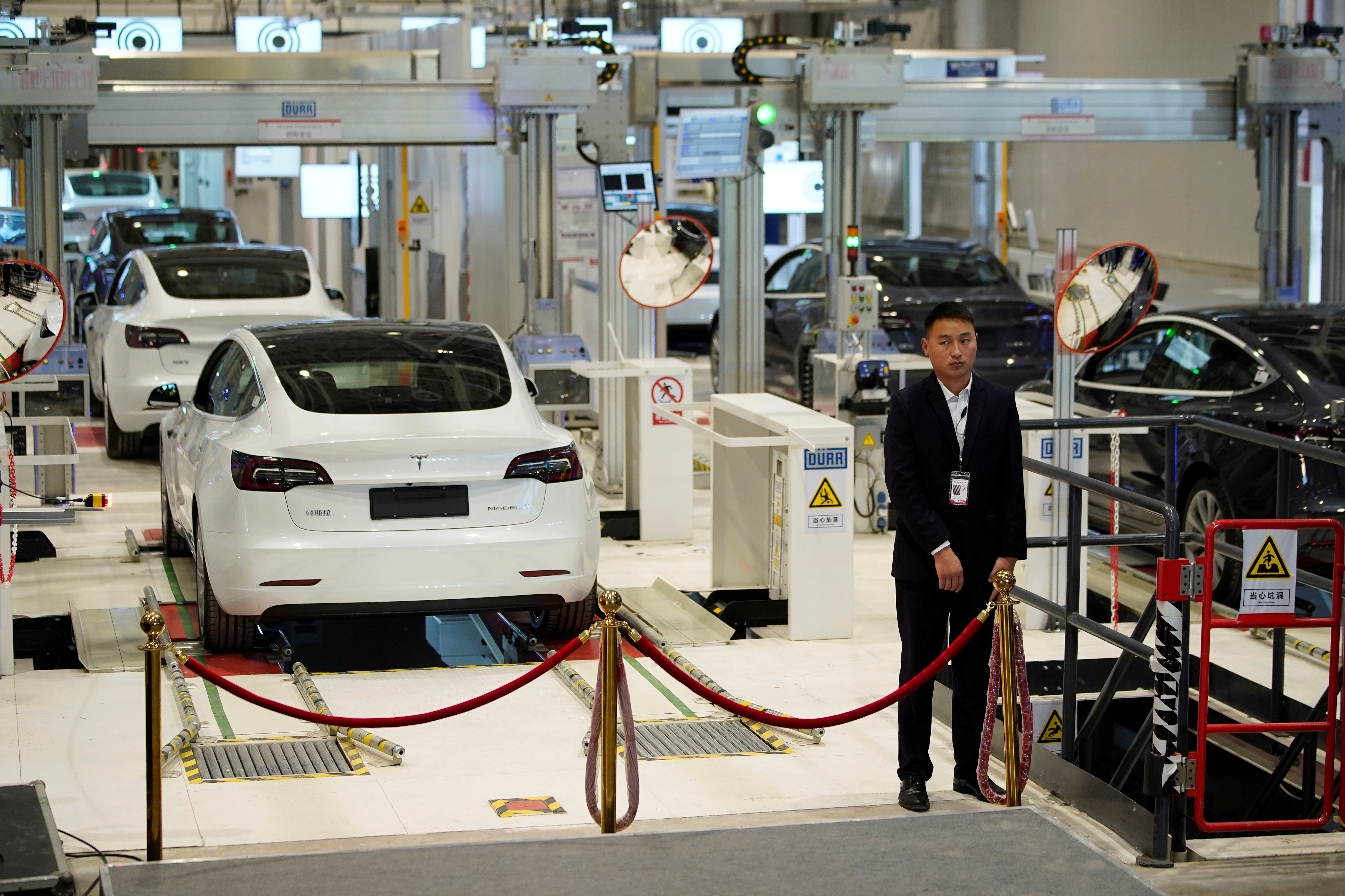 Tesla China-made Model 3 sedans are seen during a delivery event at its Shanghai factory