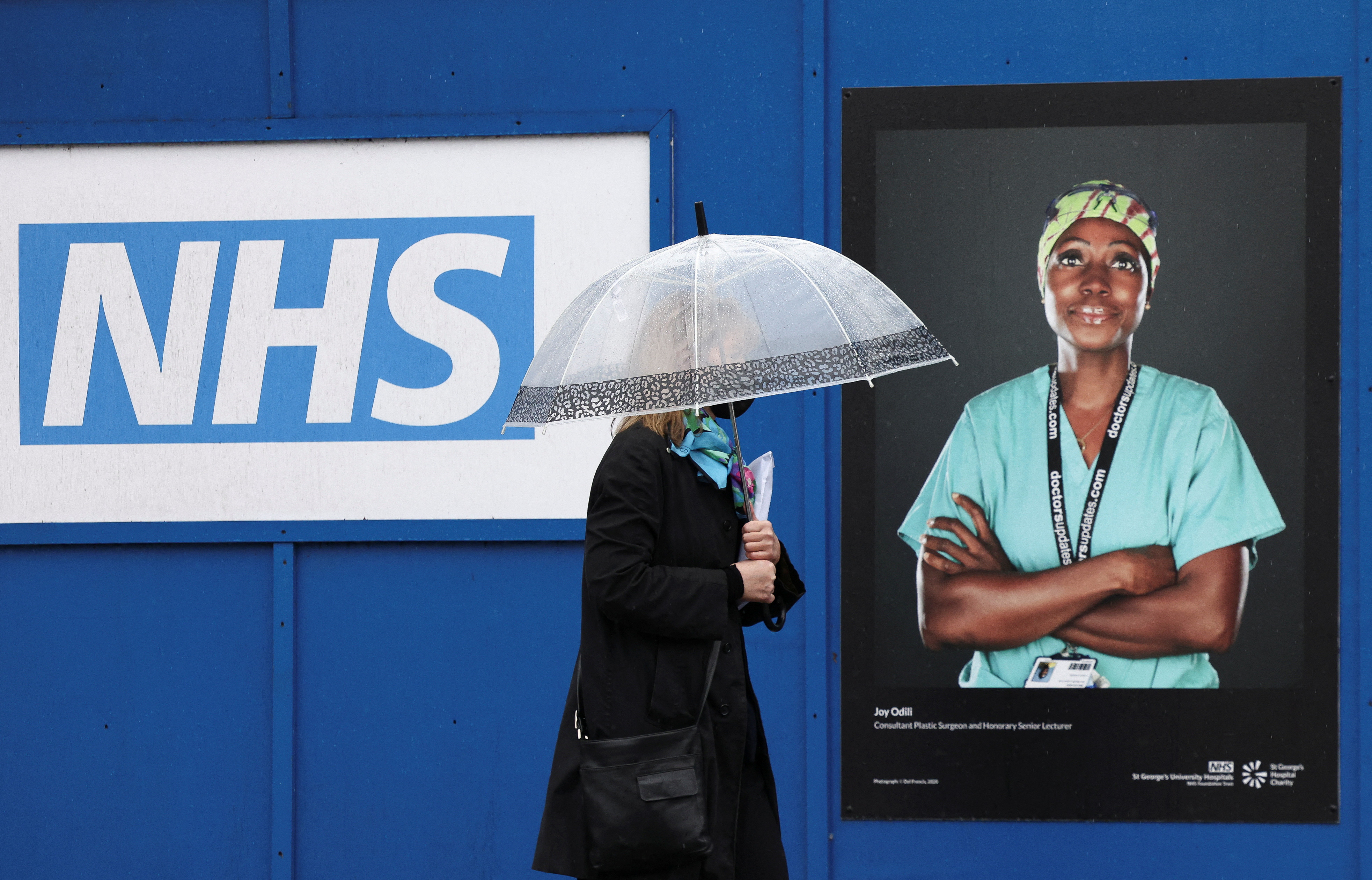 File Photo: Images of National Health Service (NHS) workers displayed on hoardings outside a temporary field hospital at St George's Hospital in London