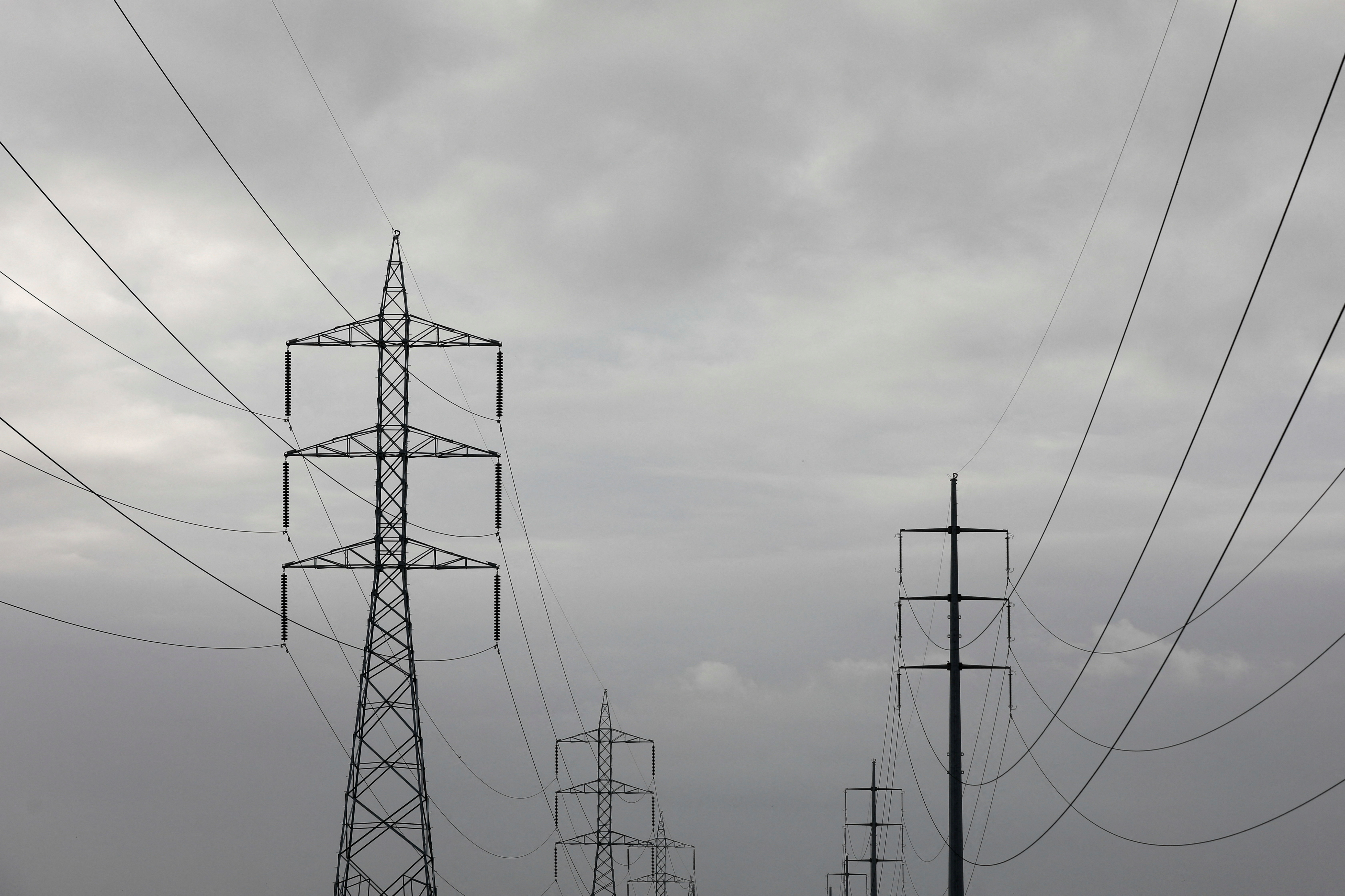 Power transmission towers are pictured in Karachi