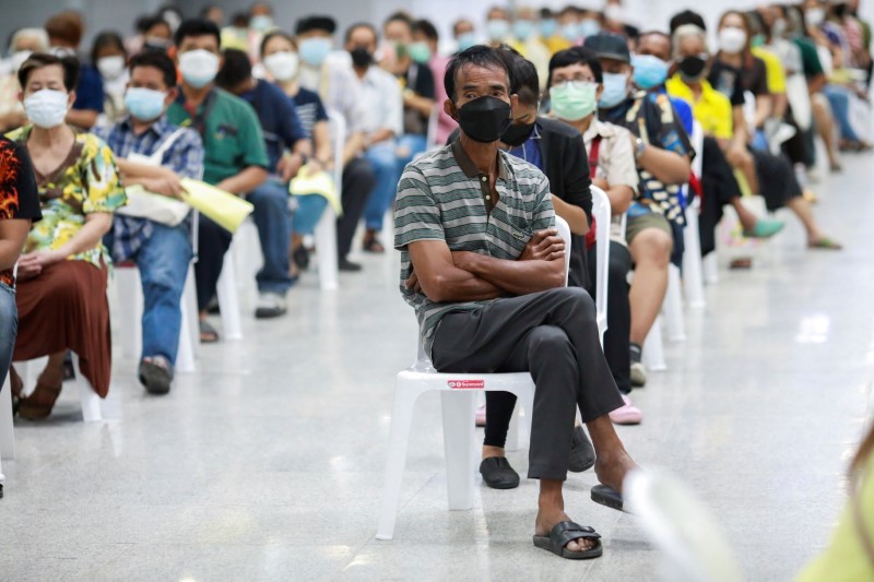 People queue at the Central Vaccination Center as Thailand begins offering first doses of the AstraZeneca vaccine to at-risk groups amid the coronavirus (COVID-19) outbreak in Bangkok, Thailand, July 26, 2021. REUTERS/Soe Zeya Tun