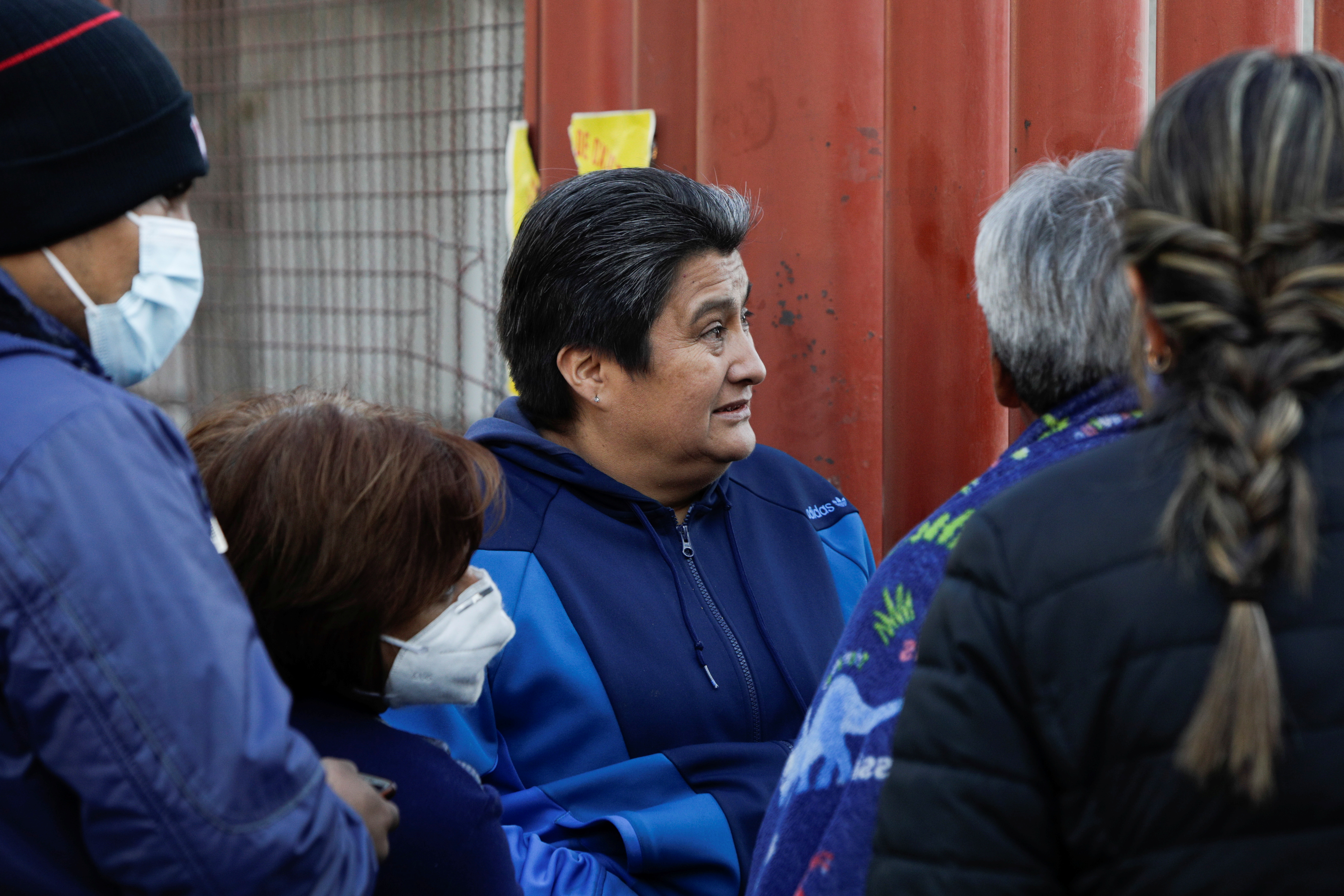 The parents of Daniel Arguello, 28, who was injured during the accident where an overpass of the metro partially collapsed with train cars on it at Olivos station, wait for news of their son outside a hospital in Mexico City, Mexico May 4, 2021. REUTERS/Luis Cortes