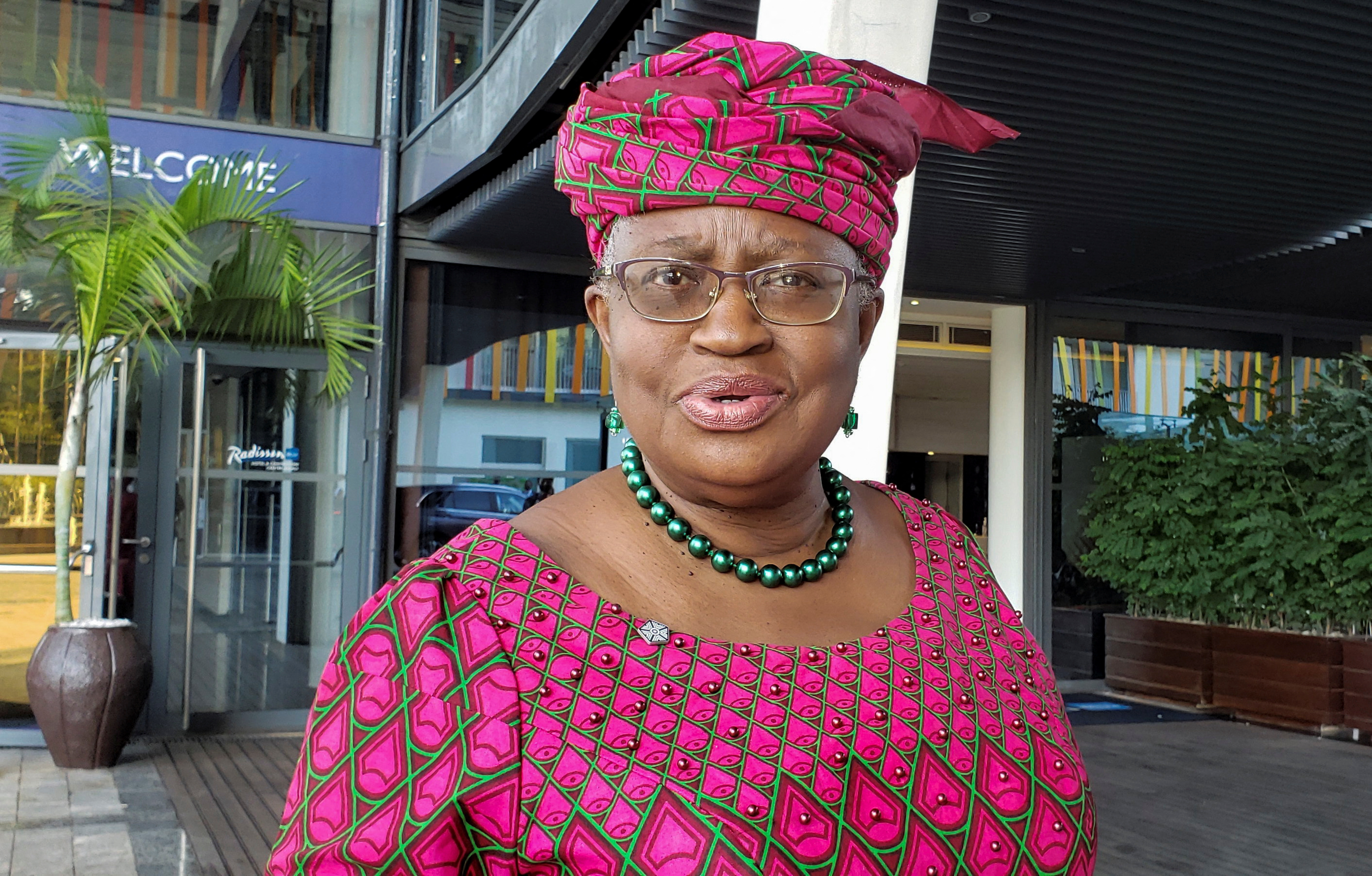 World Trade Organization Director-General Ngozi Okonjo-Iweala walks at the walks at the CHOGM in Kigali