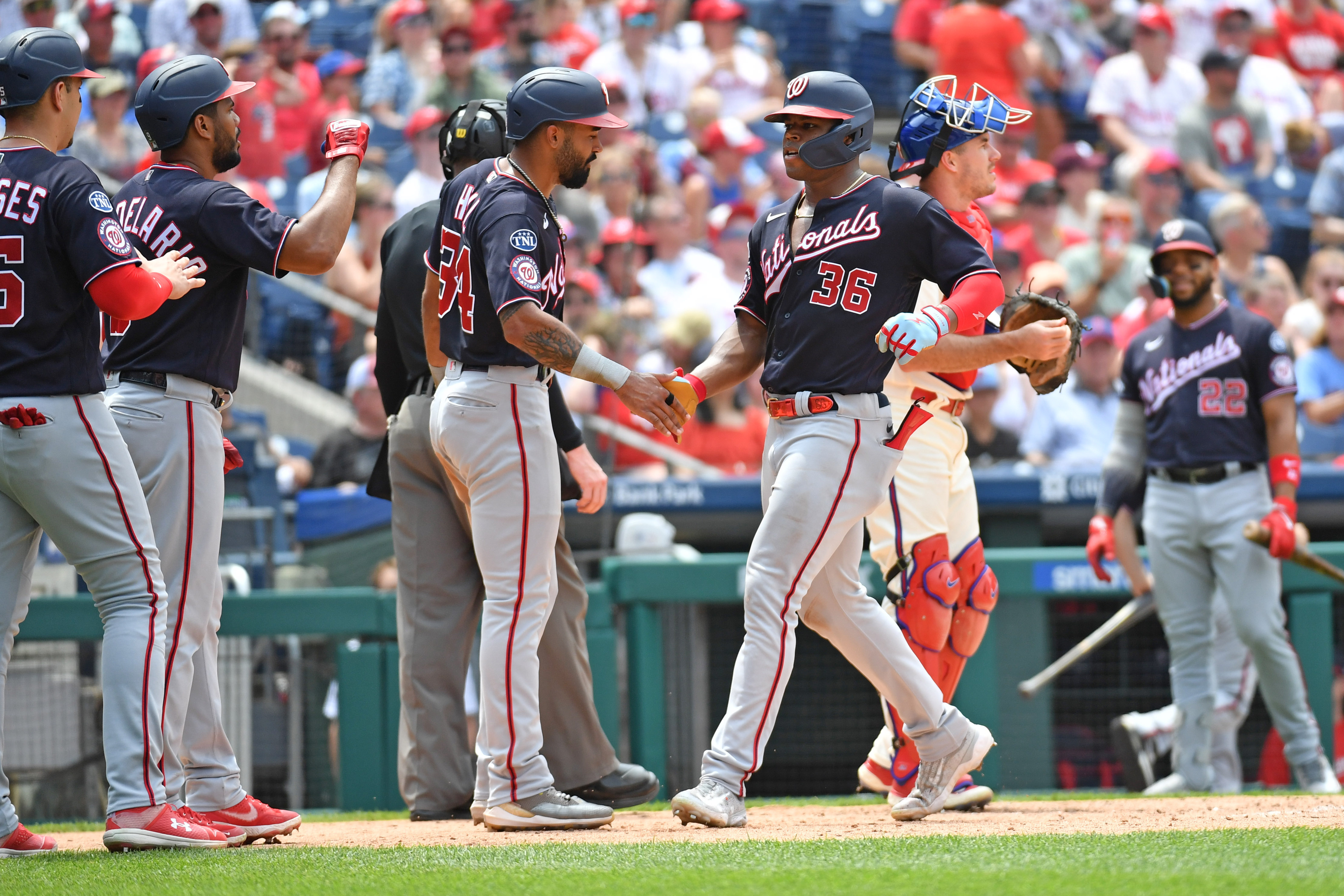 Philadelphia Phillies' Bryce Harper (3) wears a belt with (34) on it, his  old number, in the dugout during the fifth inning of a baseball game  against the Washington Nationals at Nationals