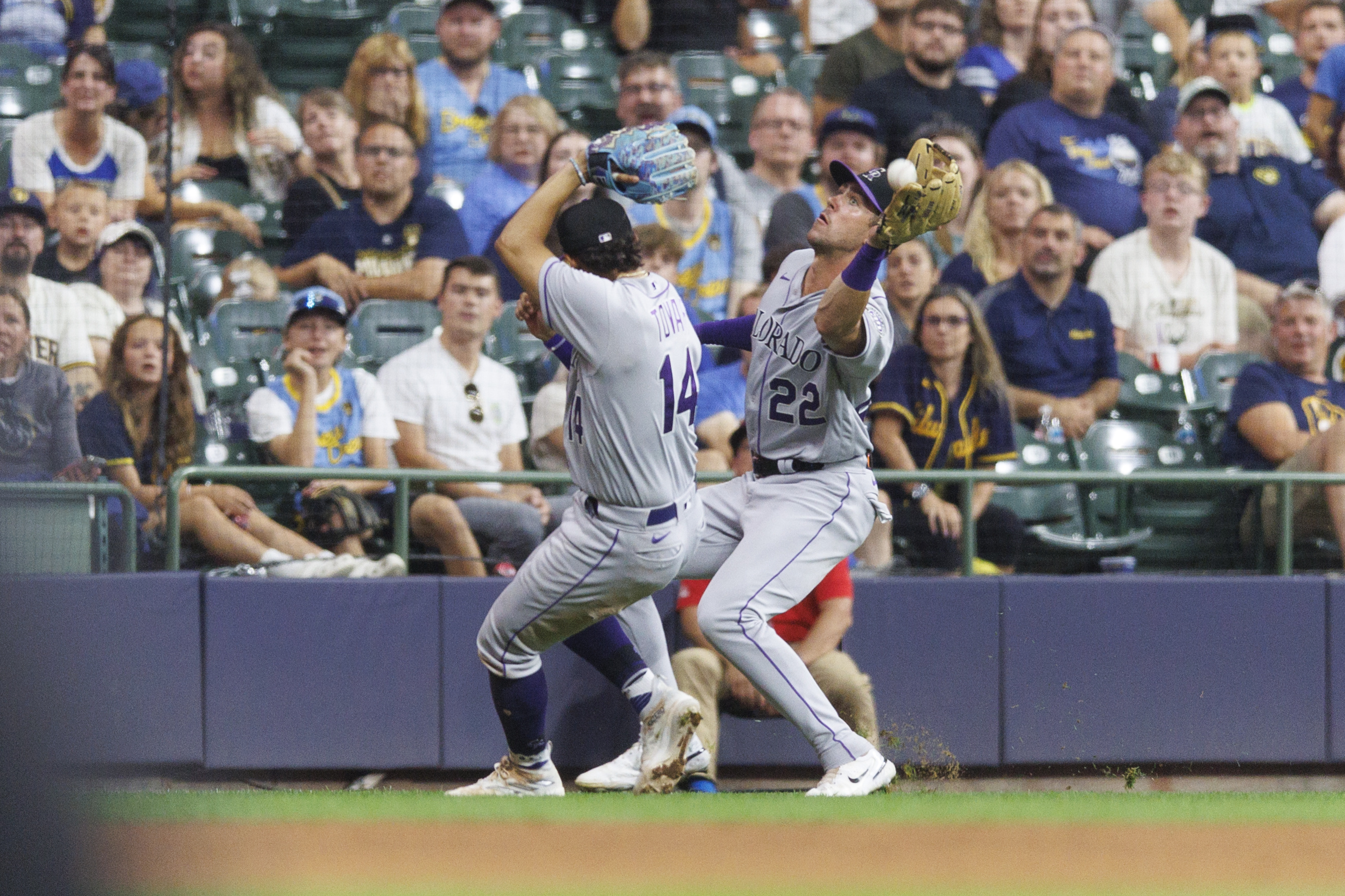 Rockies walk to bizarre, 7-4, 10-inning win over Brewers