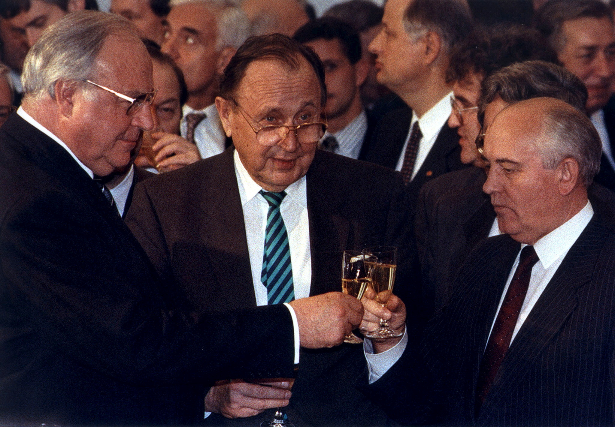 File photo of Helmut Kohl toasting with former Soviet leader Mikhail Gorbachev and former German Foreign Minister Hans-Dietrich Genscher