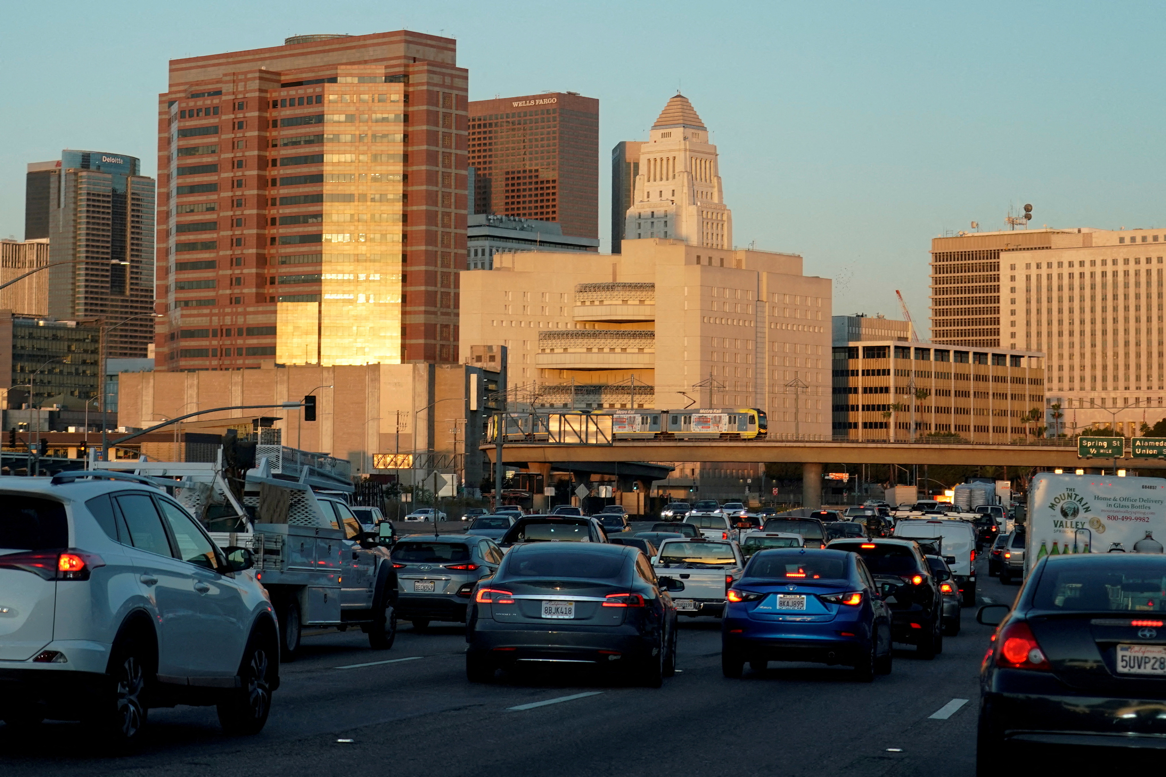 Traffic travels along a highway next to Los Angeles, California