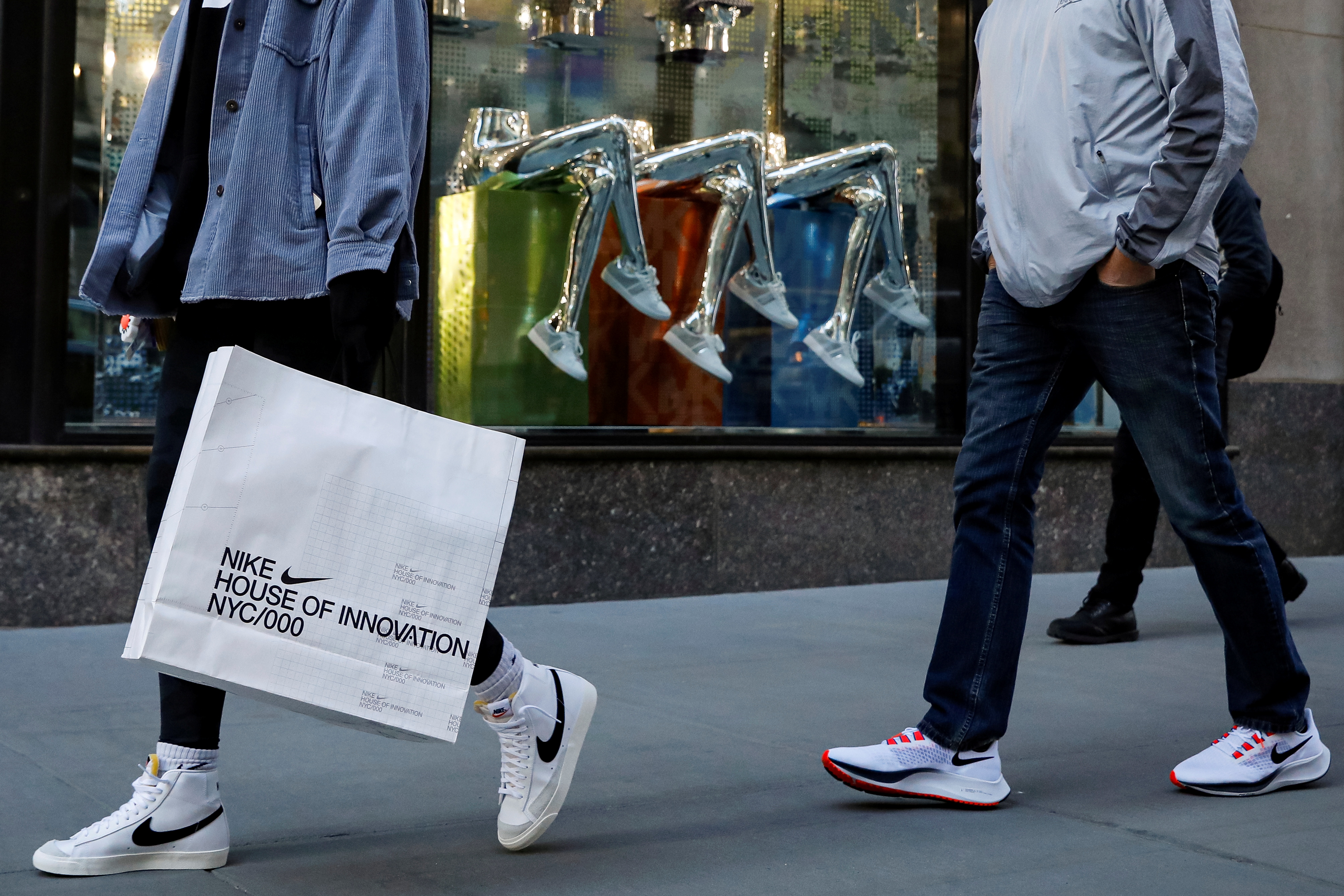 People shop on 5th Avenue in New York