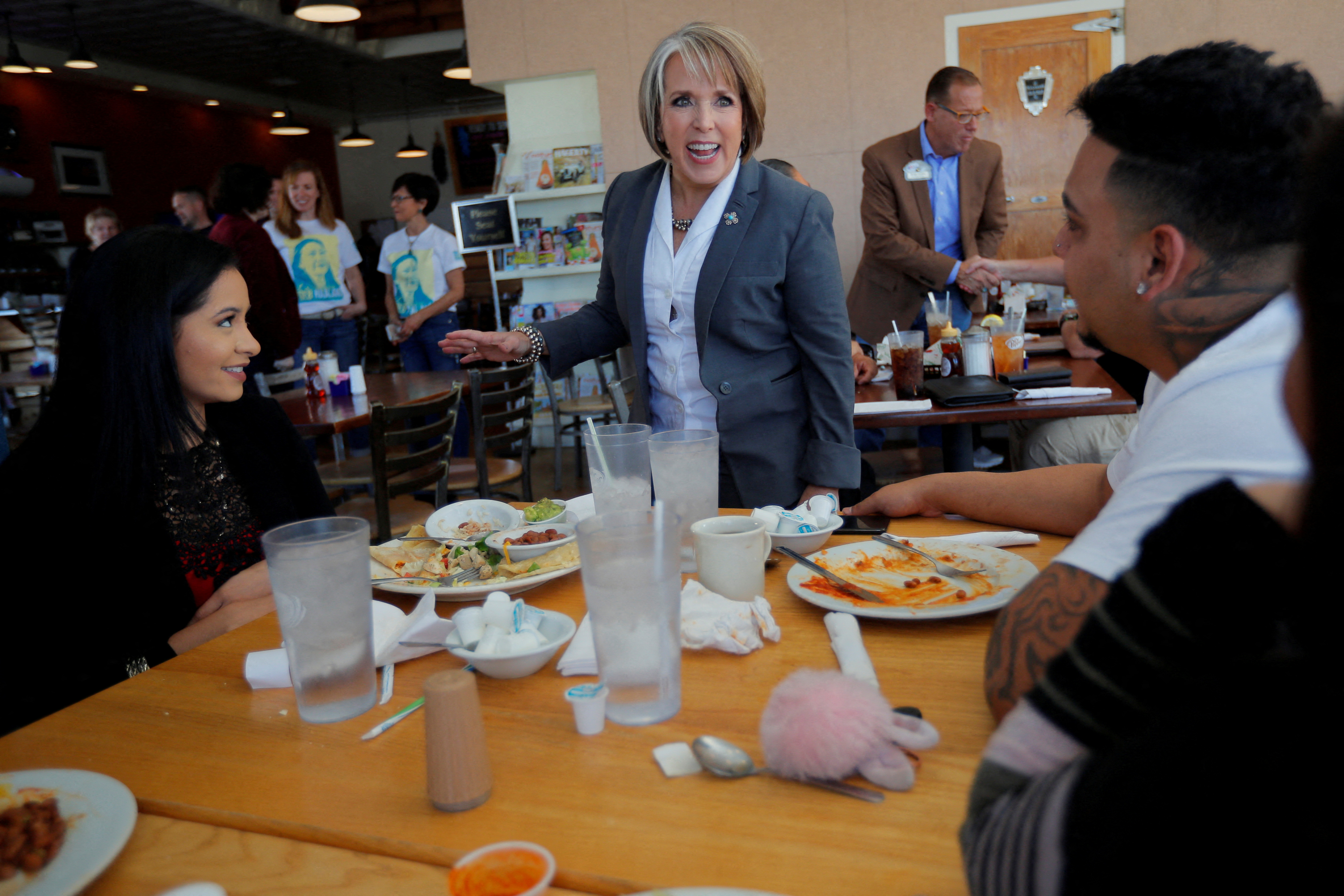 Democratic candidate for governor Michelle Lujan Grisham greets diners at Cocina Azul on midterm elections day in Albuquerque