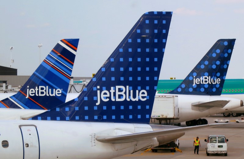 JetBlue Airways aircrafts are pictured at departure gates at John F. Kennedy International Airport in New York