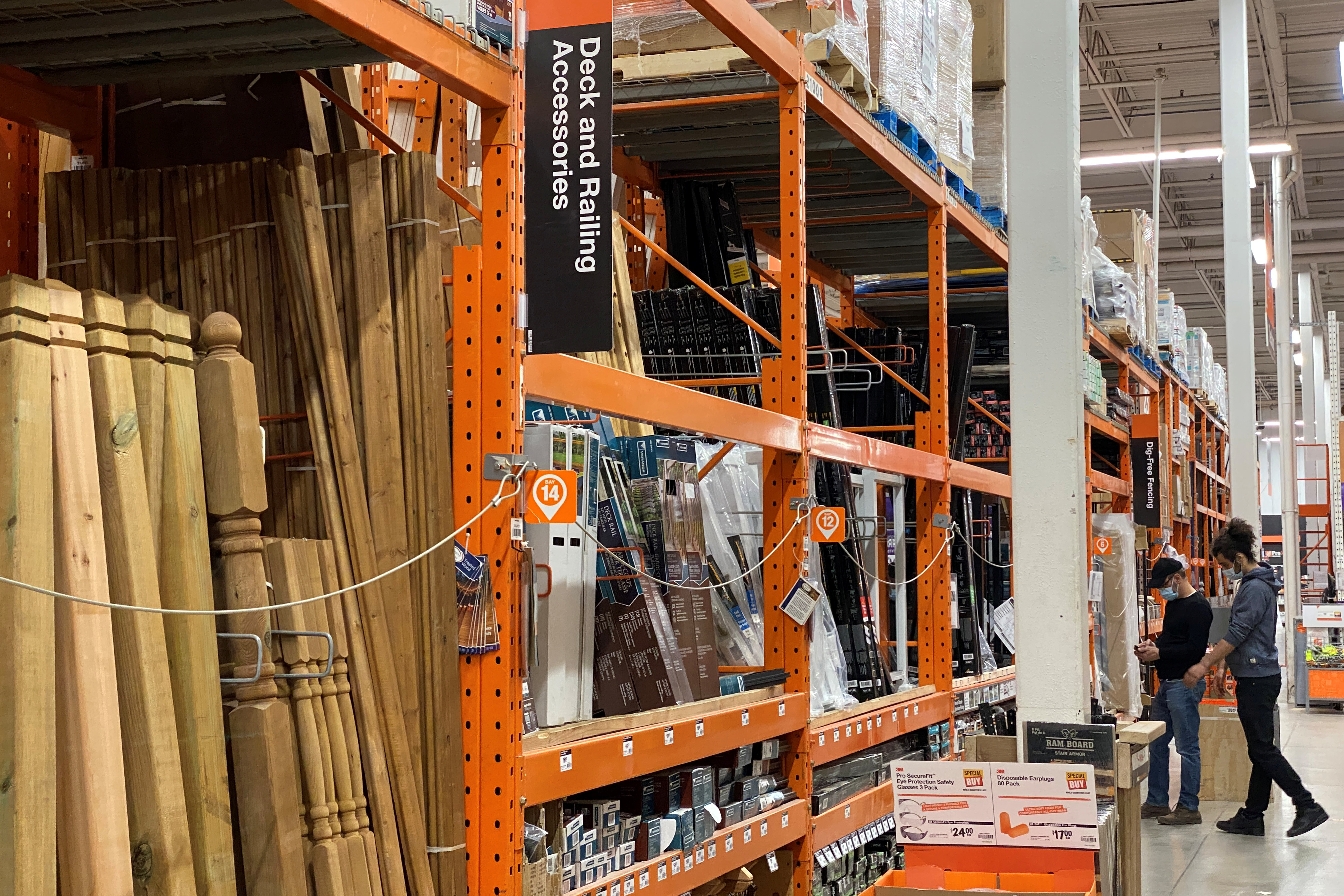 FILE PHOTO - Customers browse among the decking supplies aisle in a Home Depot store in Toronto