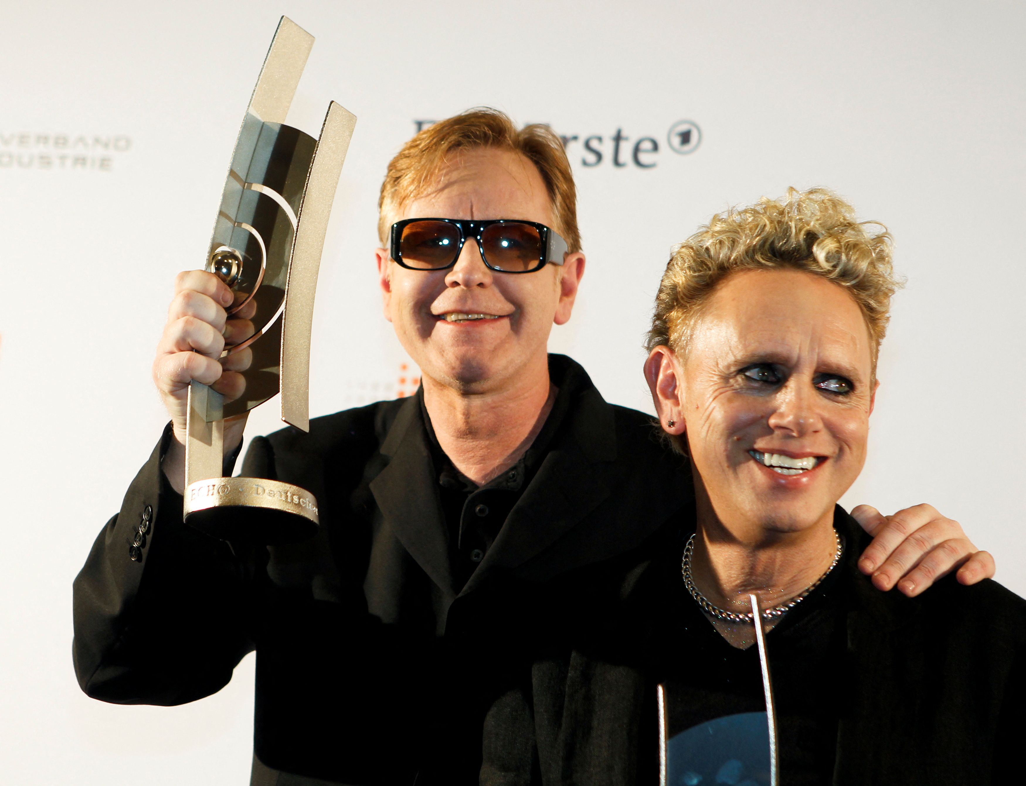 Gore and Fletcher of British band Depeche Mode pose with trophies at Echo Music Awards ceremony in Berlin