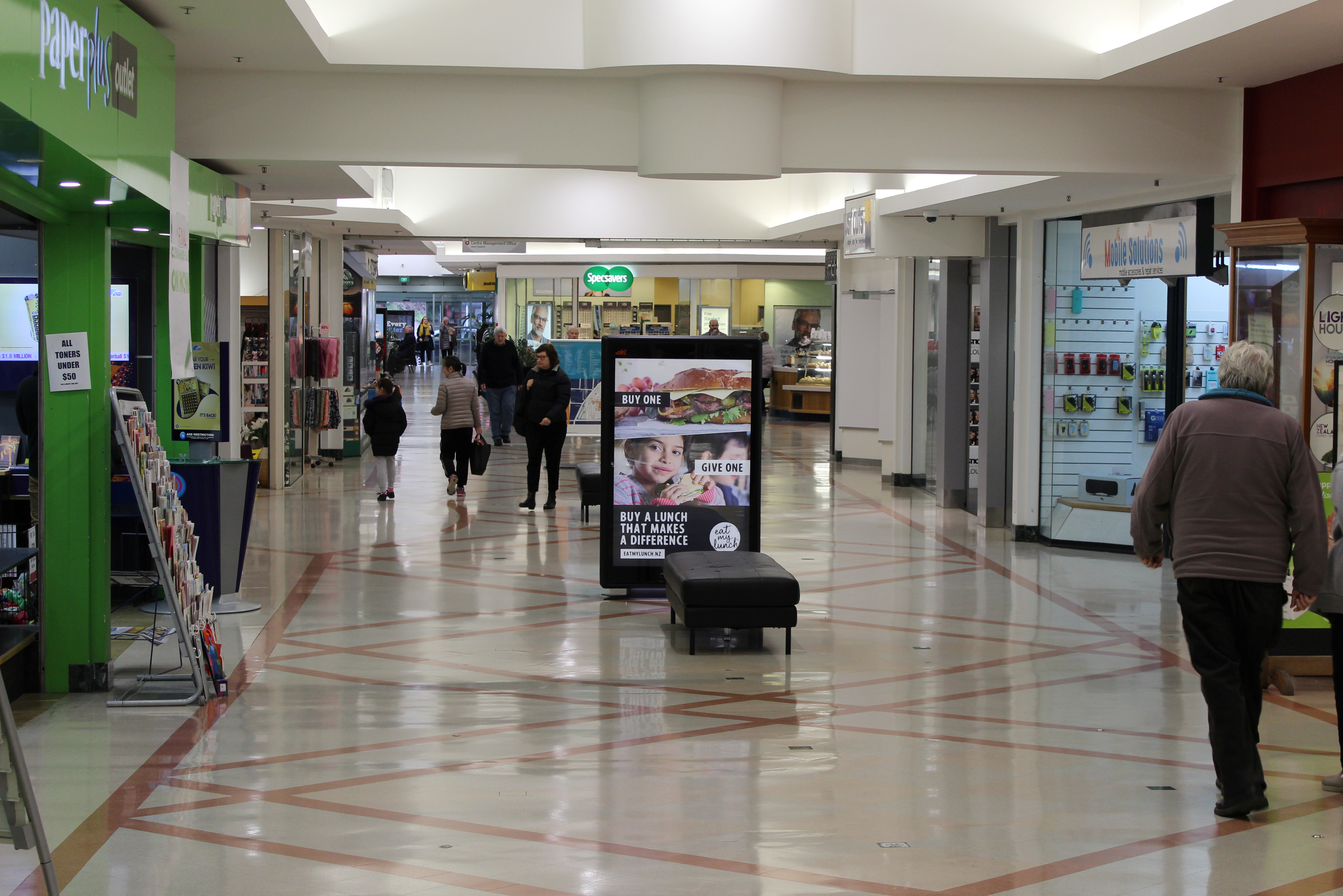 Shoppers are seen at a mall in Wellington, New Zealand
