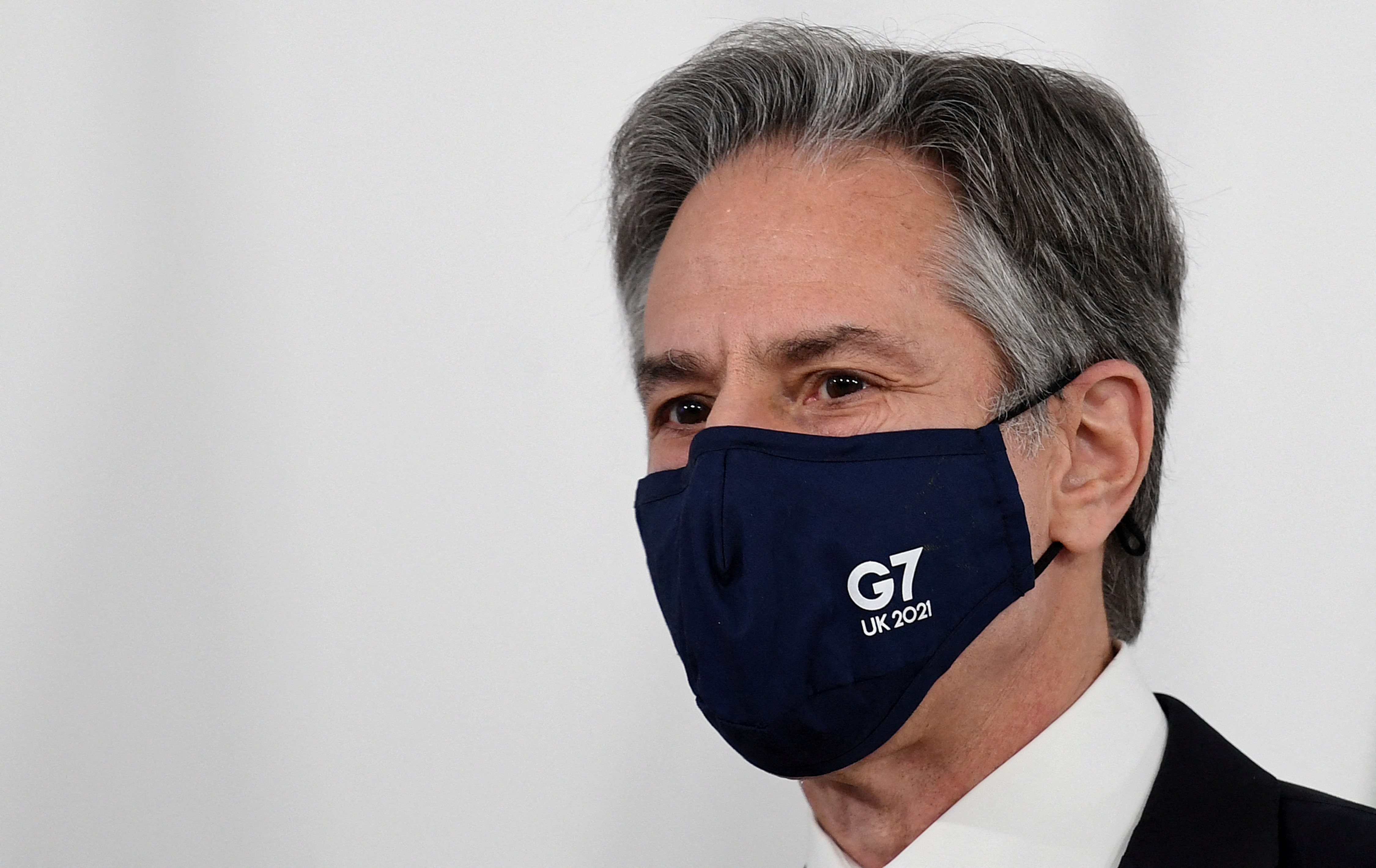 U.S. Secretary of State Antony Blinken, wearing a face covering to combat the coronavirus spread, attends a G7 foreign and development ministers session with guest countries and ASEAN nations on the final day of the summit in Liverpool, Britain December 12, 2021. Olivier Douliery/Pool via REUTERS