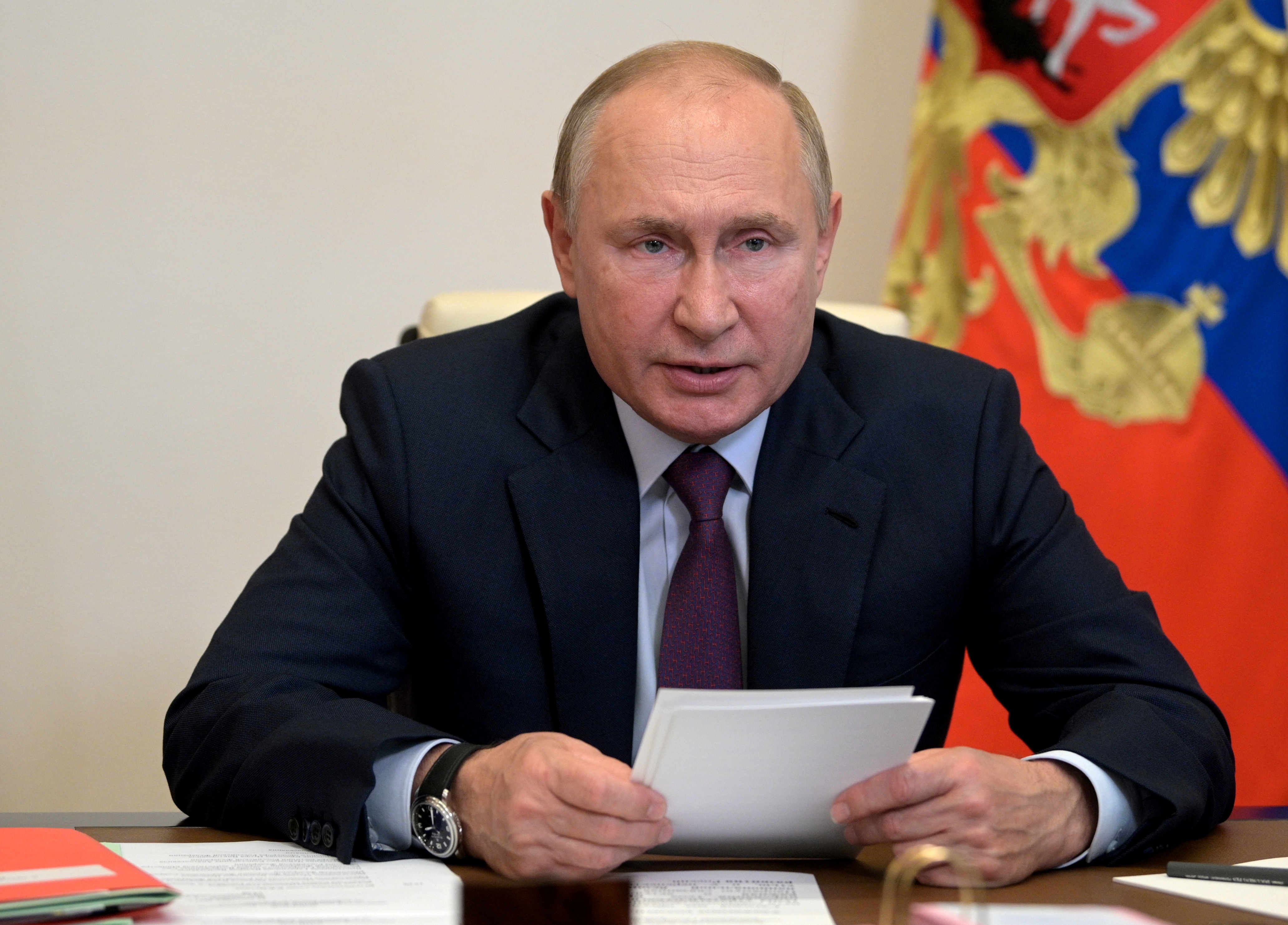 Russian President Putin chairs a meeting with members of the Security Council via a video link outside Moscow