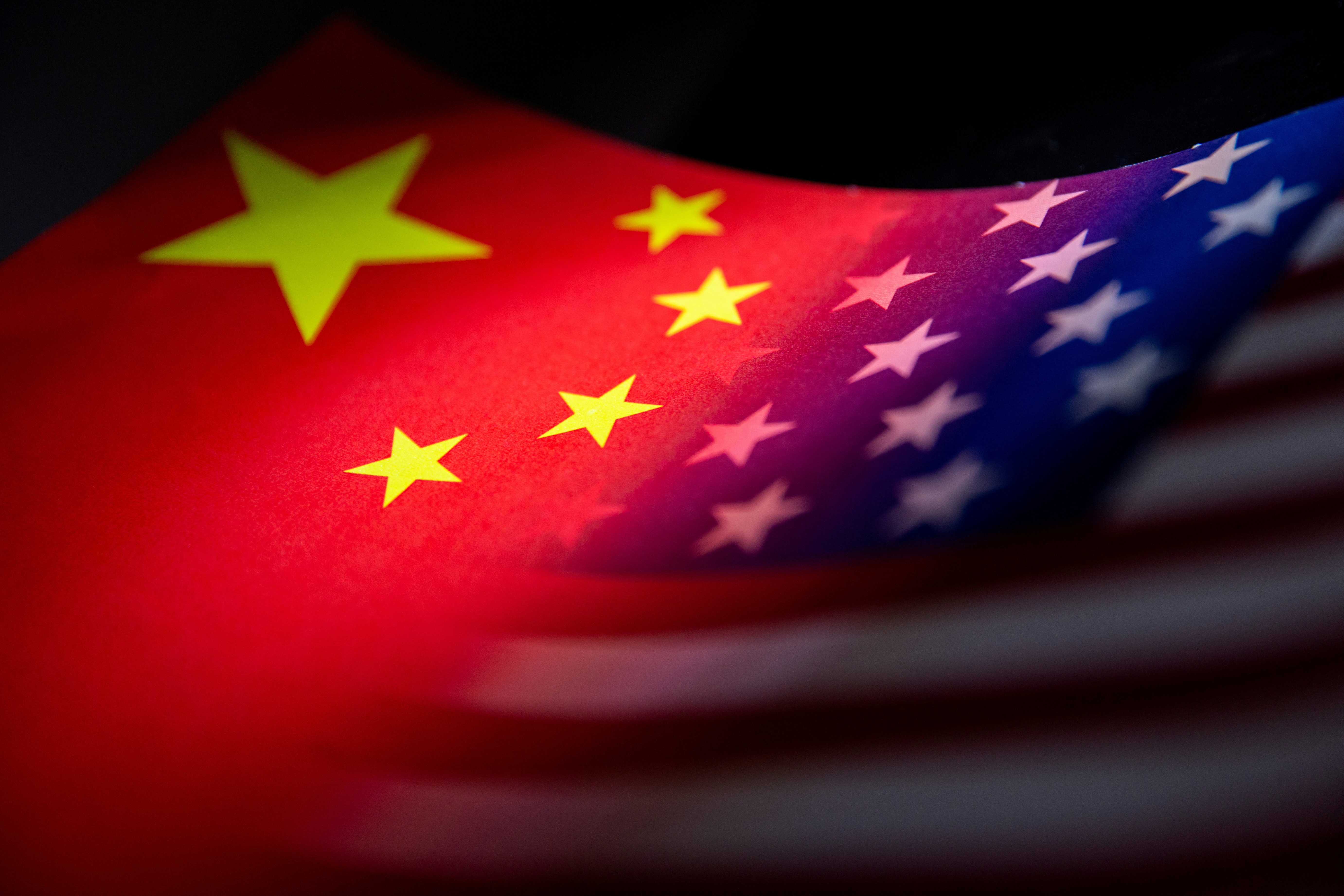 Illustration shows China and U.S. flags