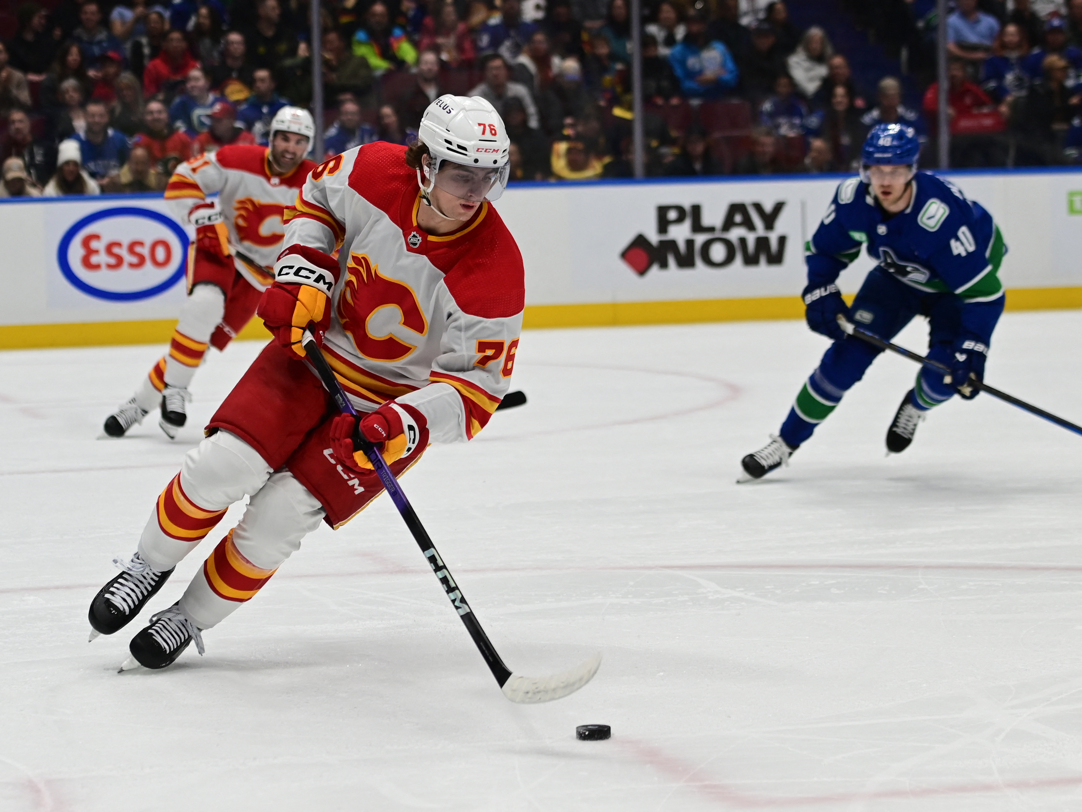 Nils Hoglander Scores Twice As Canucks Top Flames | Reuters