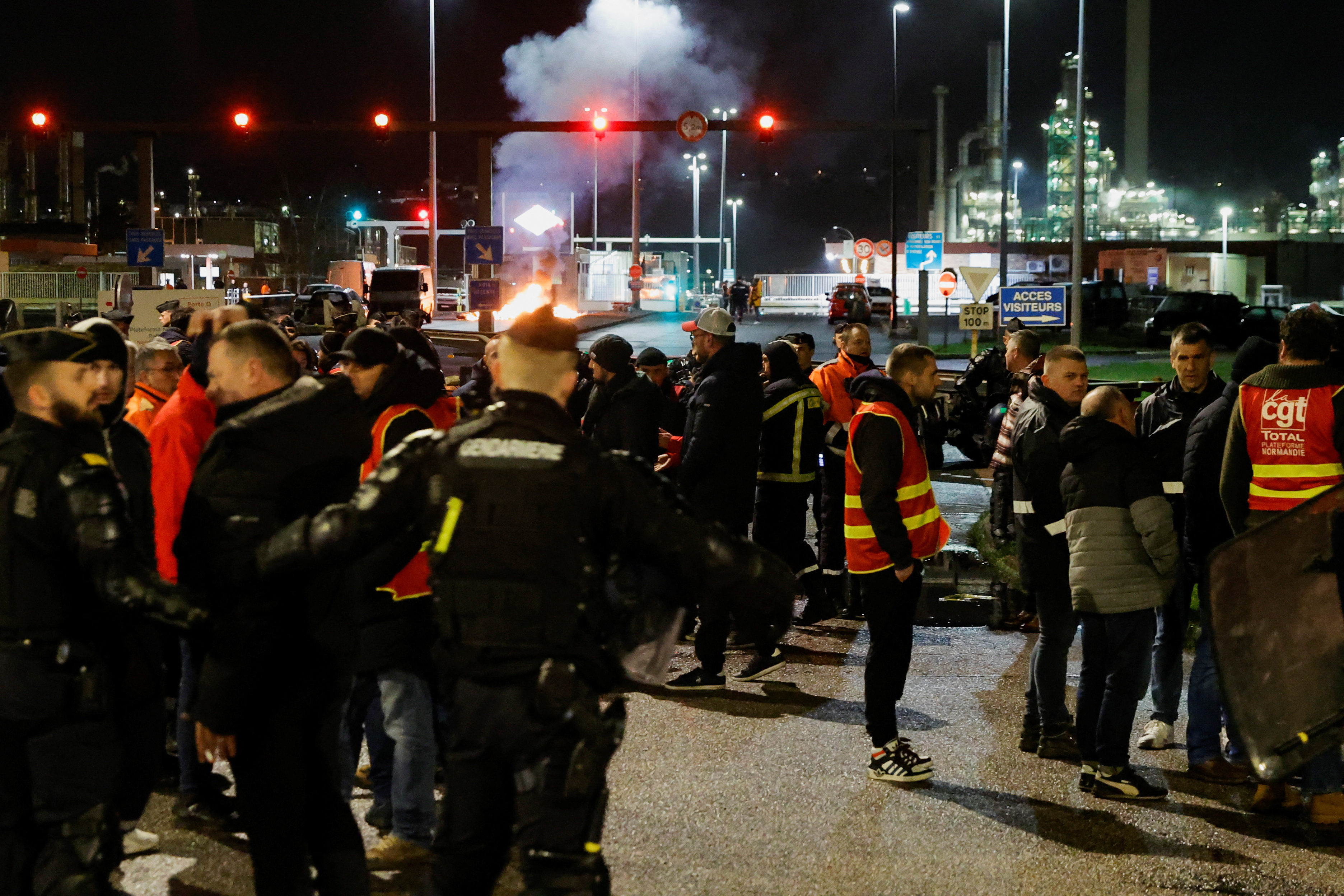 French riot police officers push back energy workers on strike in front of the TotalEnergies refinery, in Gonfreville-L’Orcher