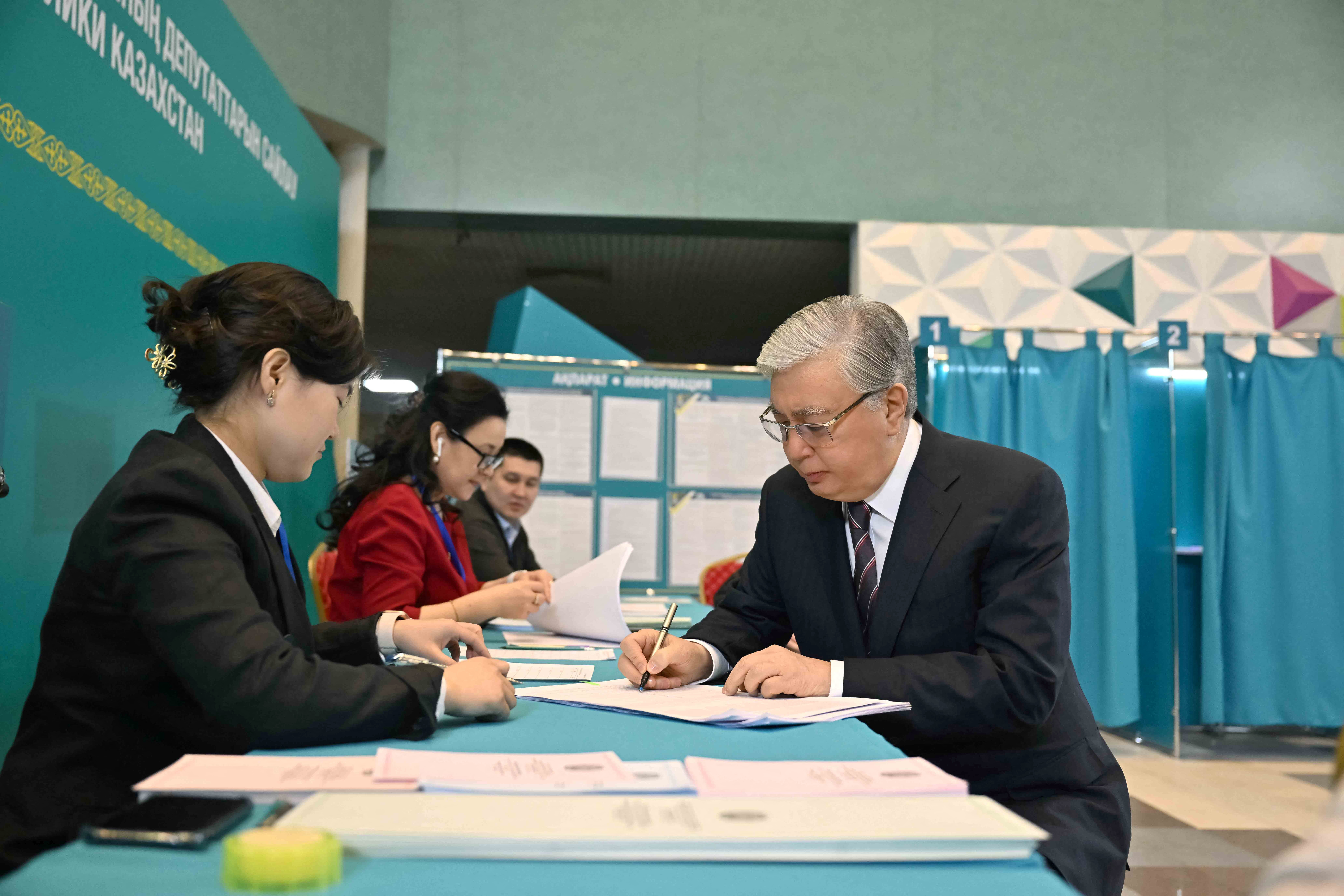 Kazakh President Kassym-Jomart Tokayev votes during parliamentary elections, in Astana