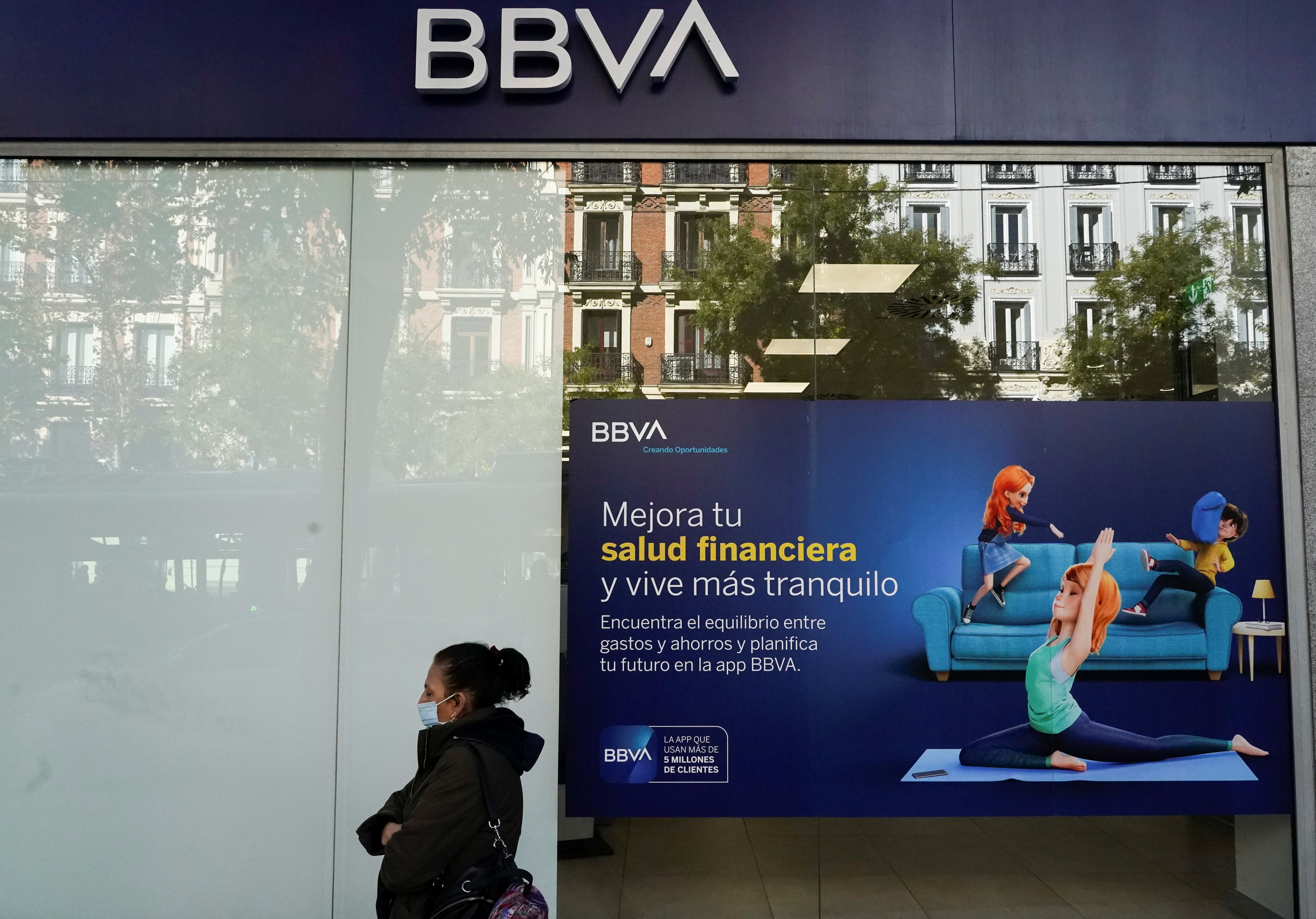 A woman walks past a BBVA bank branch in Madrid, Spain, November 15, 2021. REUTERS/Juan Medina
