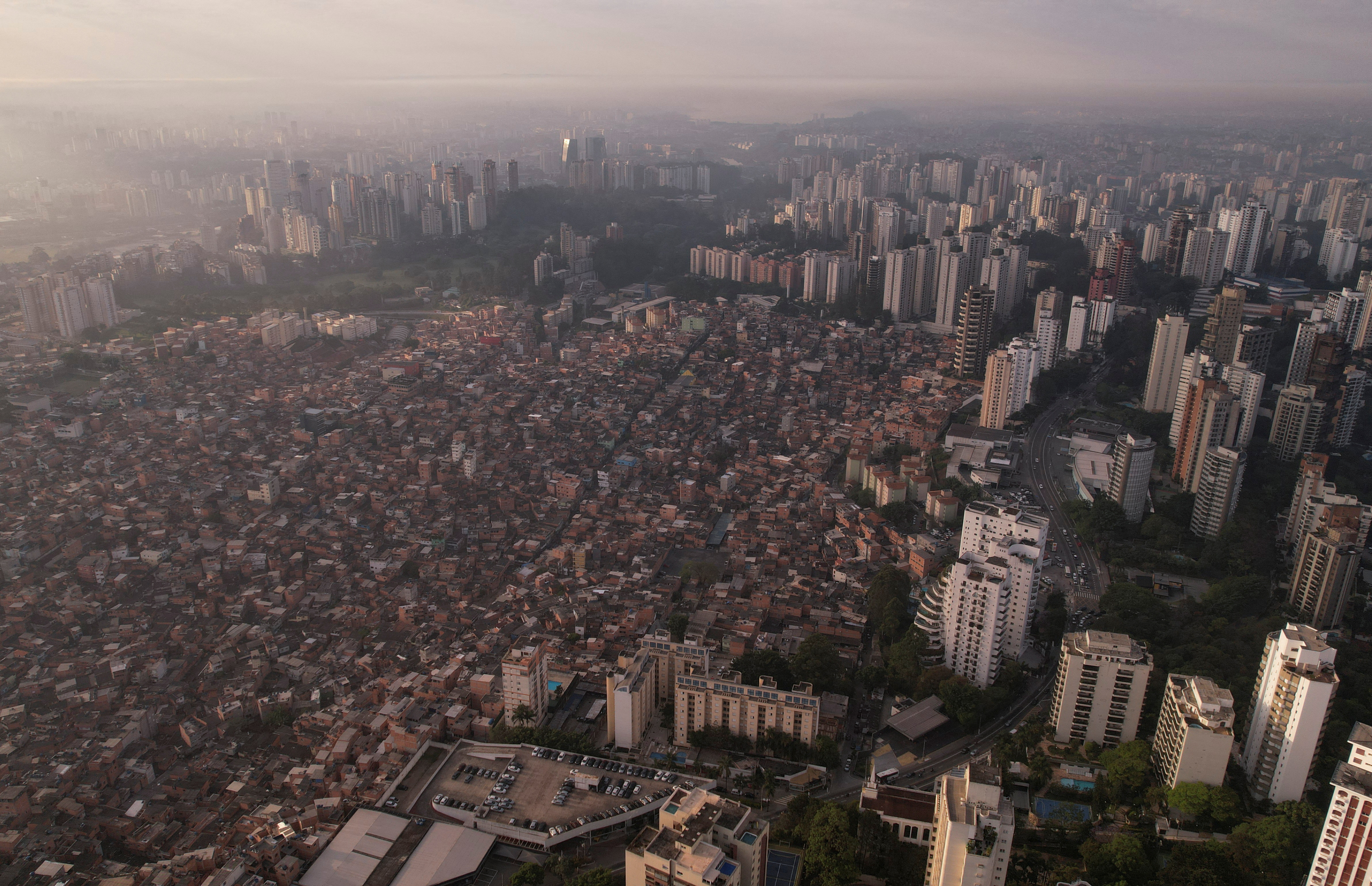 An aerial view shows Paraisopolis slum and buildings from Morumbi neighbourhood in Sao Paulo