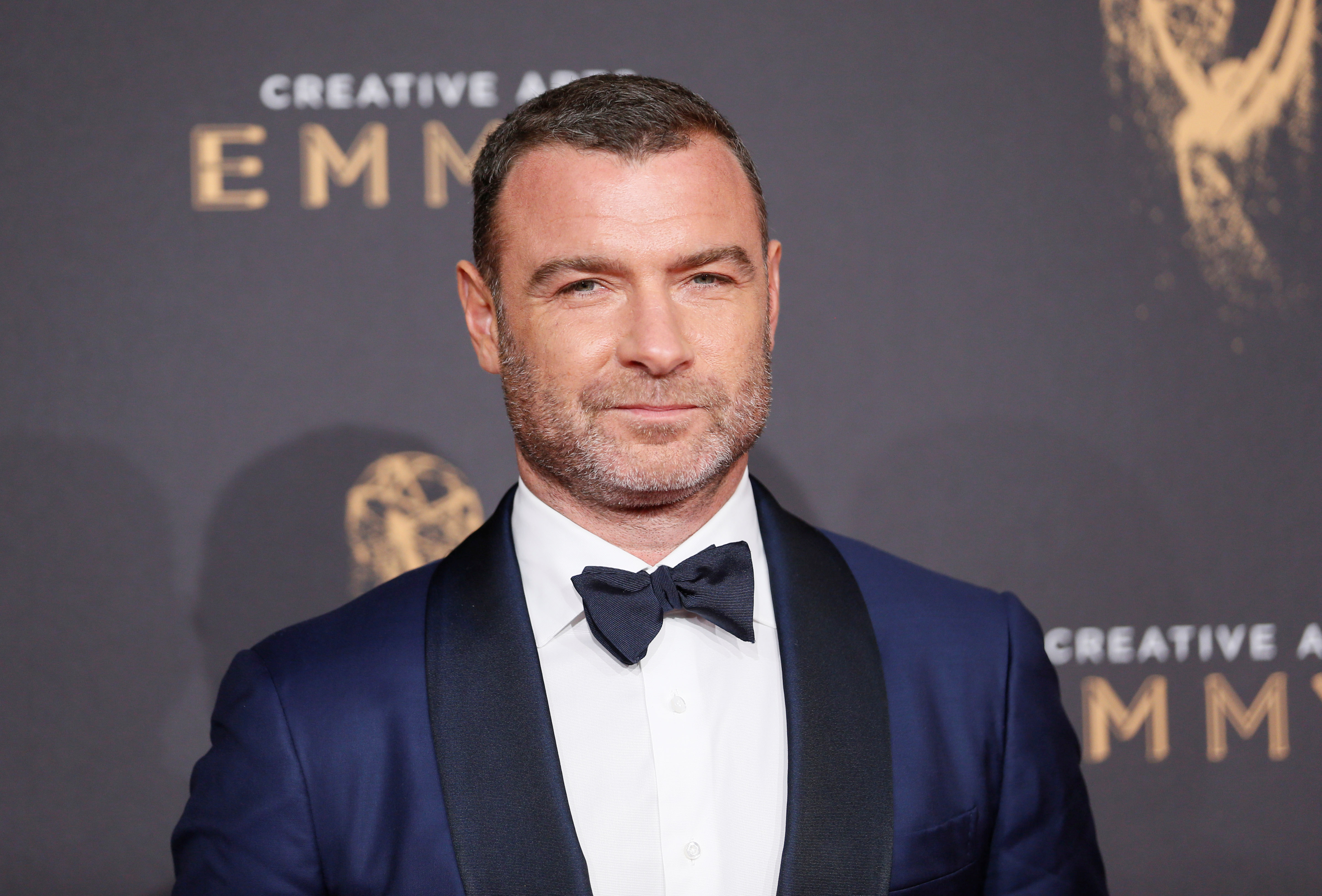 Actor Liev Schreiber poses at the 2017 Creative Arts Emmy Awards in Los Angeles, California