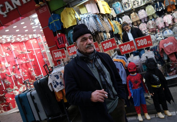 A man pauses in front of a shop in a popular middle-class shopping district in Istanbul