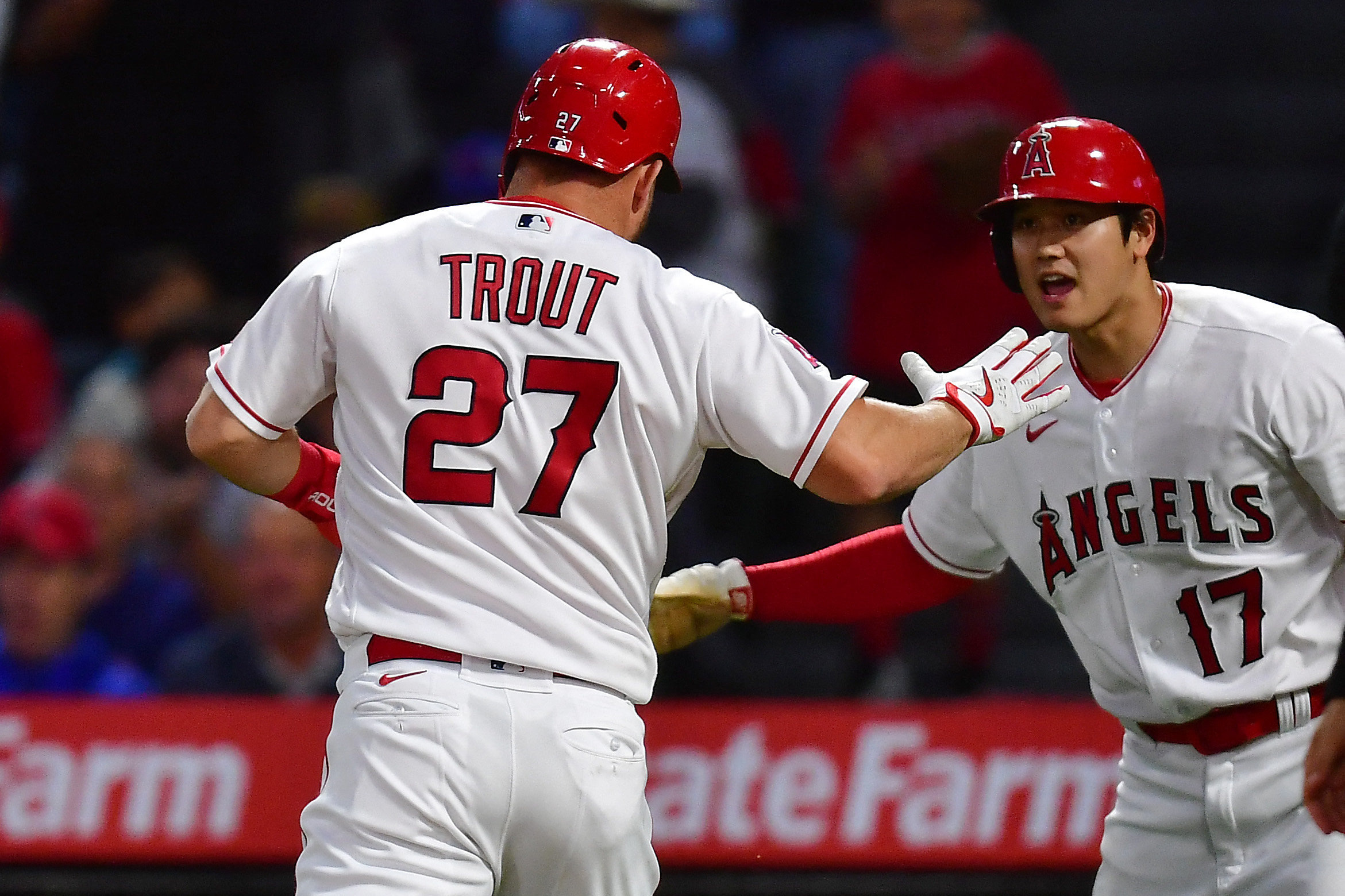 Seiya Suzuki (R) of the Chicago Cubs and Mike Trout of the Los