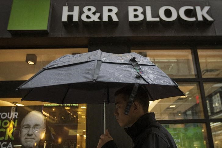 A man passes by an H&R Block tax center in New York