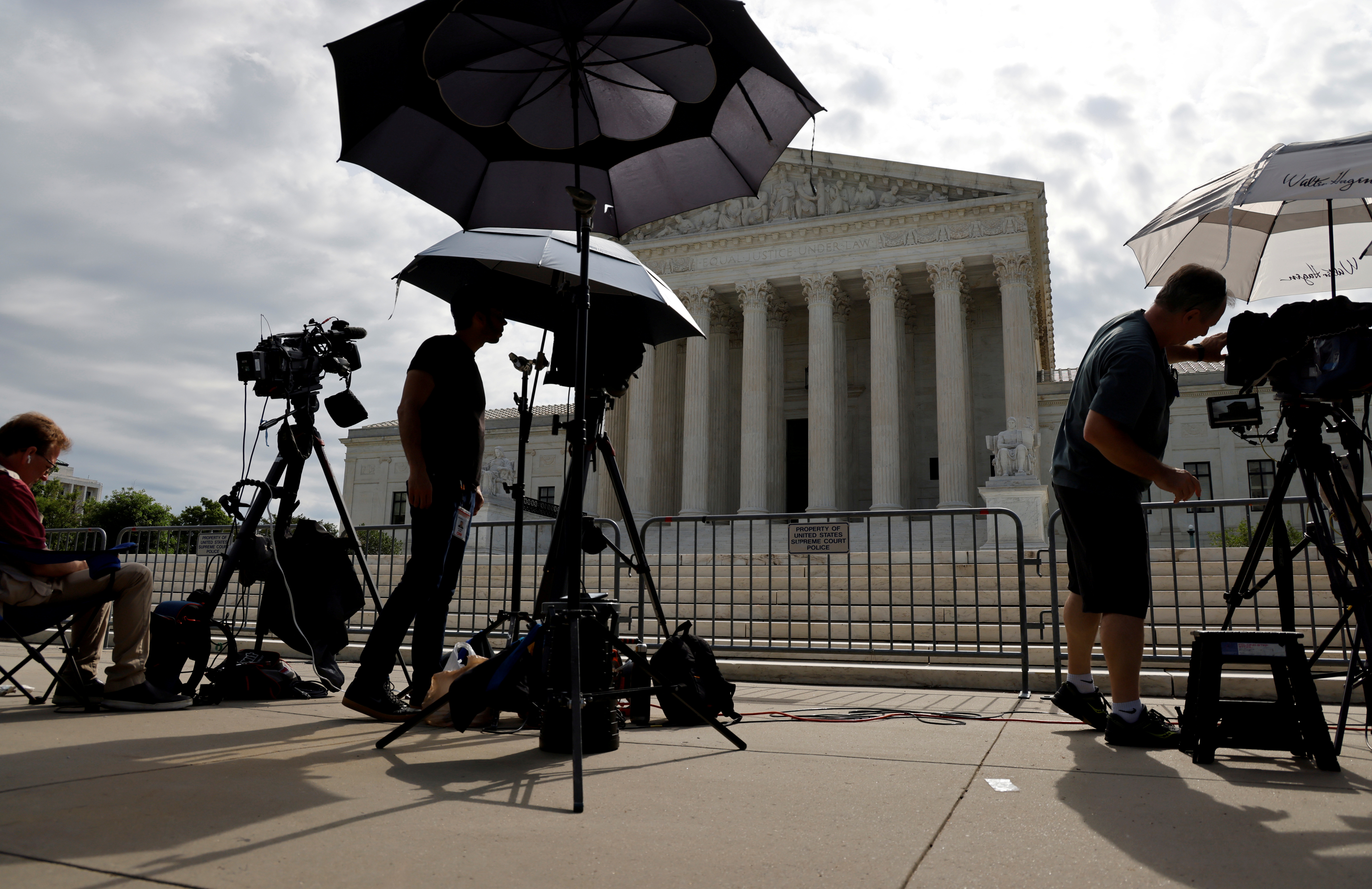 Television news photographers prepare to cover the final opinions of the current court’s term at the U.S. Supreme Court building in Washington, U.S. July 1, 2021.  REUTERS/Jonathan Ernst/File Photo