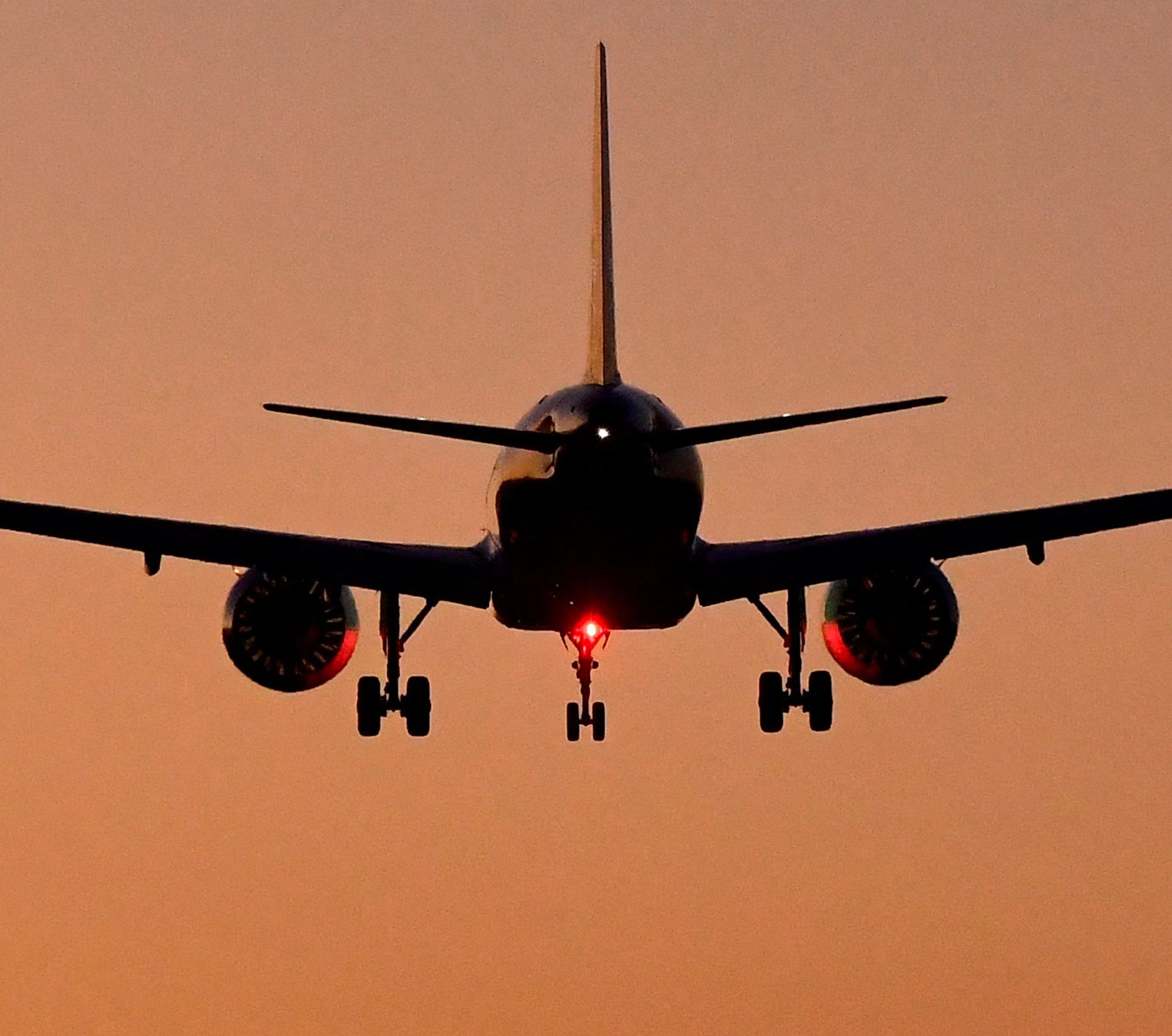 A passenger aircraft descends to land at Heathrow Airport in London
