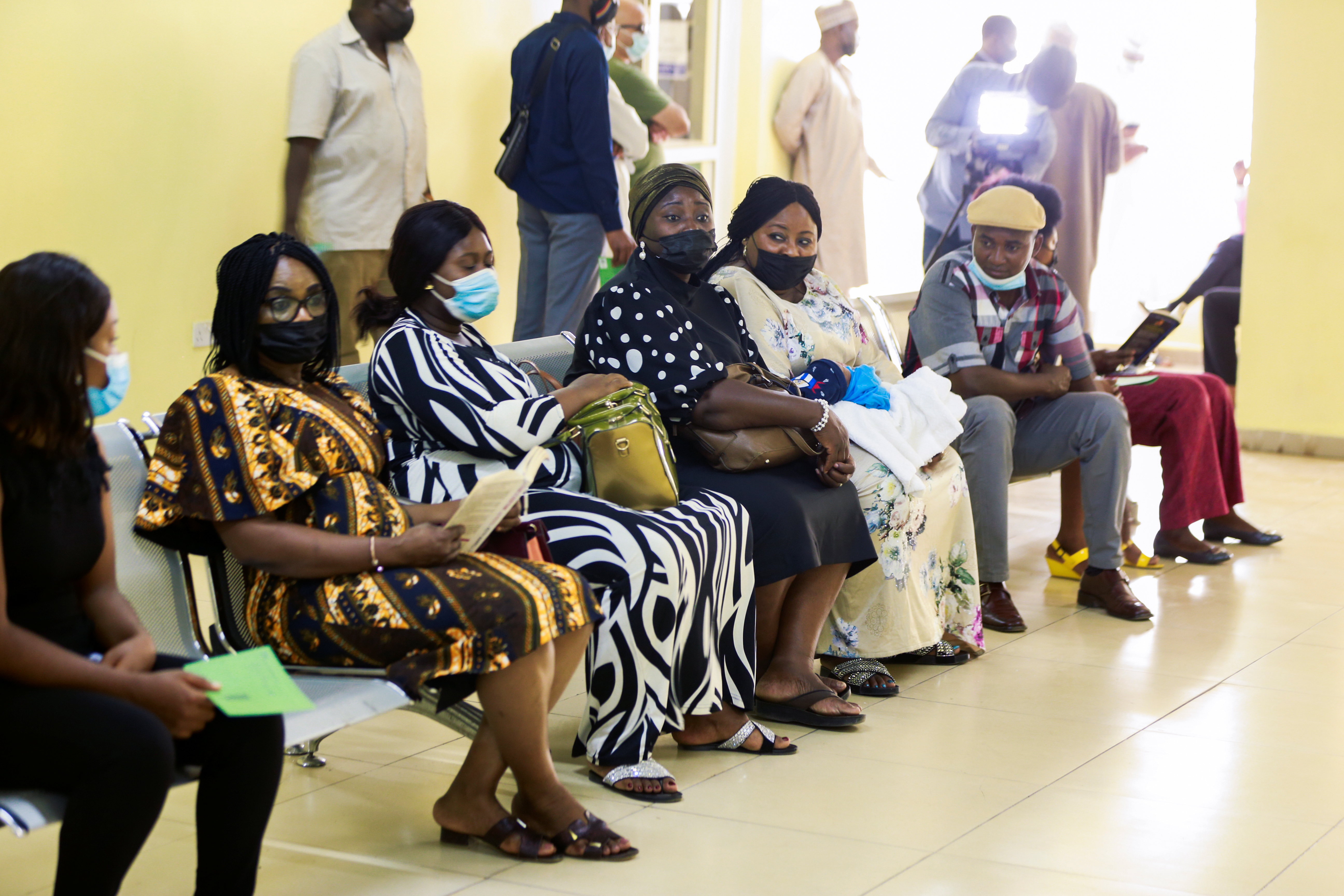 People wait after receiving the AstraZeneca's COVID-19 vaccine at the National Hospital in Abuja, Nigeria March 31, 2021. REUTERS/Afolabi Sotunde