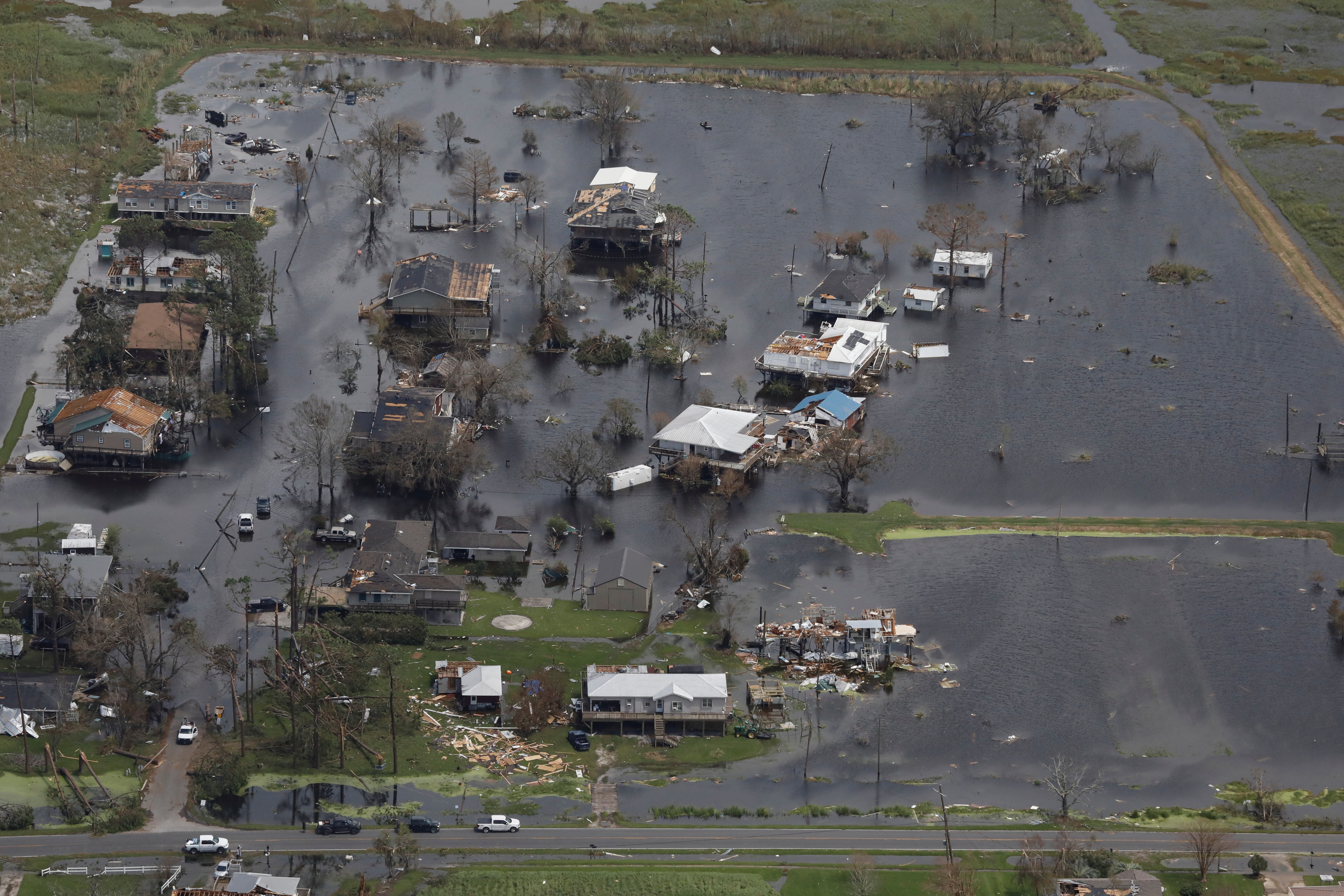 An aerial view shows destroyed houses in a flooded area after Hurricane Ida made landfall in Louisiana, in Montegut, Louisiana, U.S. August 31, 2021. REUTERS/Marco Bello