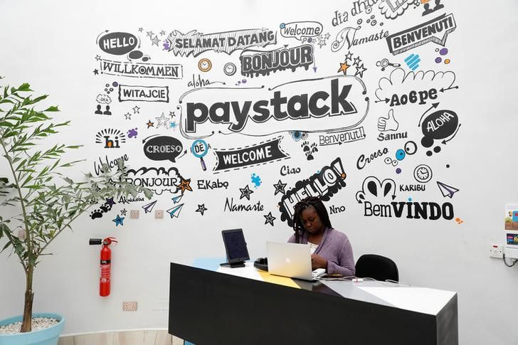 A staff member works at the reception of the paystack online payment company in the government reserved area in Ikeja, in Lagos