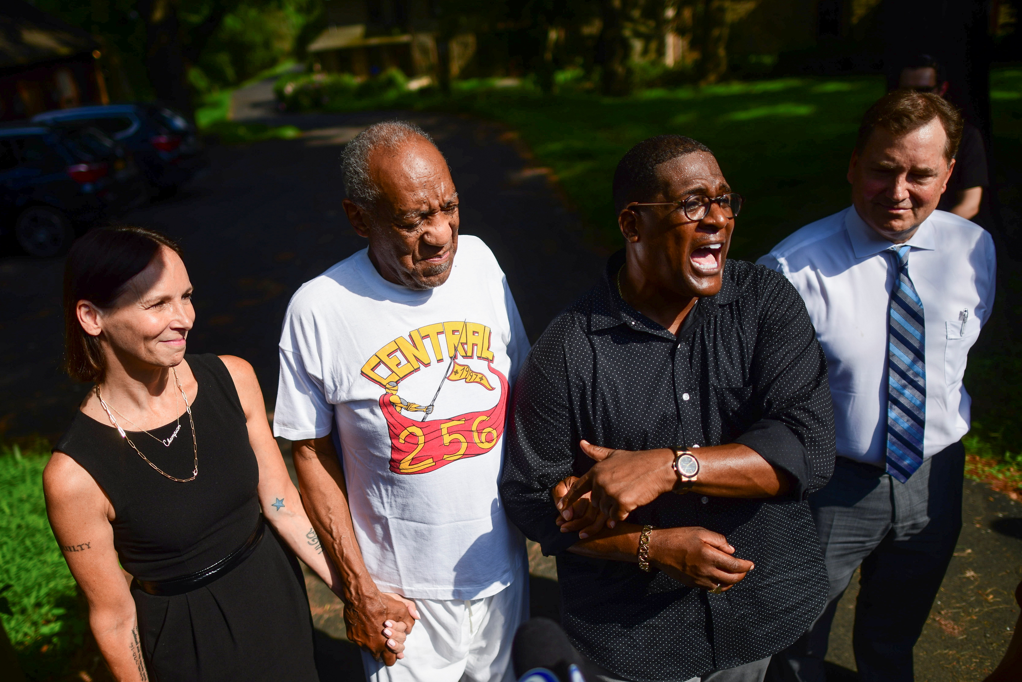 Bill Cosby stands next to his spokesman Andrew Wyatt and lawyer Jennifer Bonjean outside Cosby's home after Pennsylvania's highest court overturned his sexual assault conviction and ordered him released from prison immediately, in Elkins Park, Pennsylvania, U.S., June 30, 2021.  REUTERS/Mark Makela 