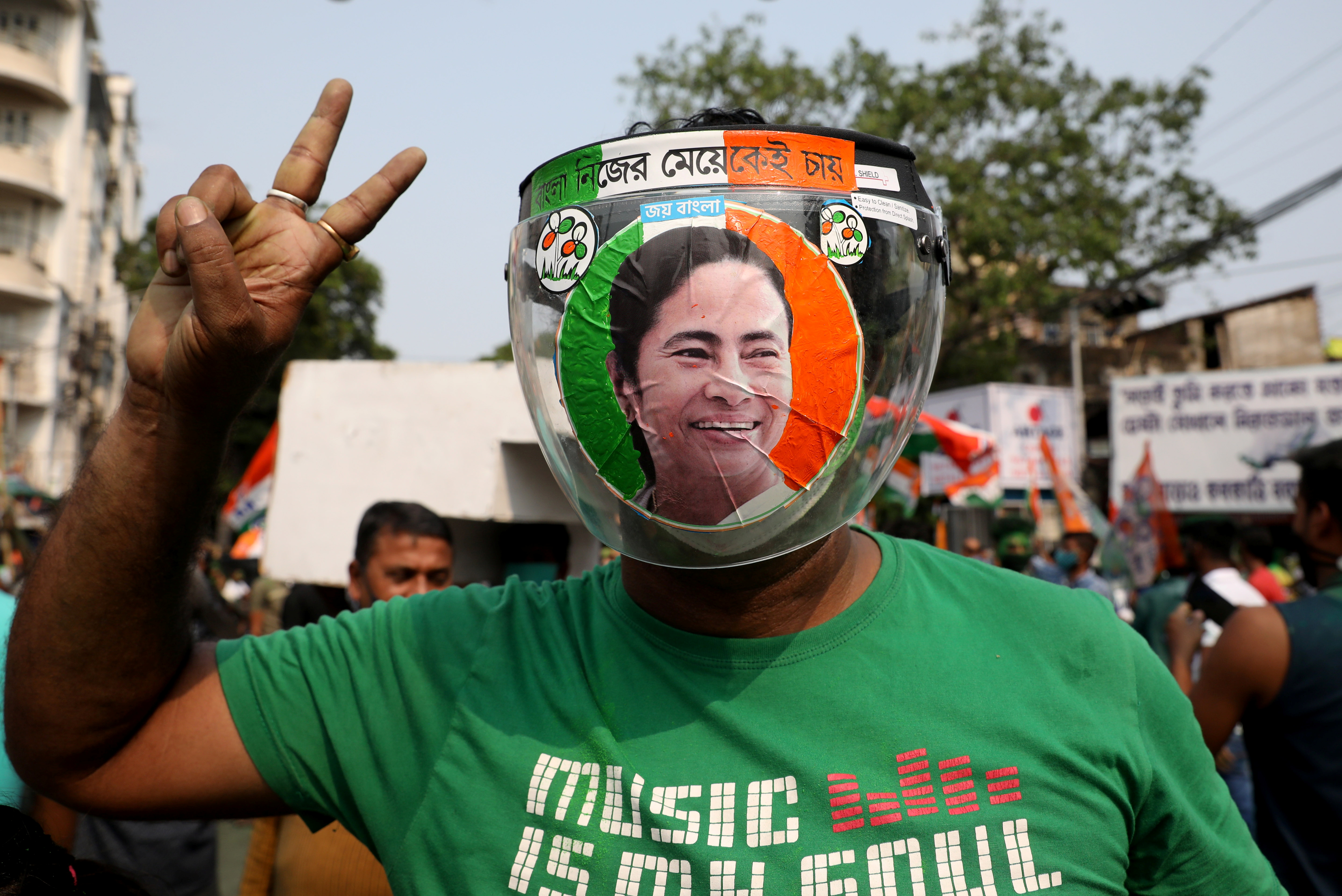 A supporter of the Chief Minister of West Bengal state and the Chief of Trinamool Congress (TMC) Mamata Banerjee gestures, in Kolkata