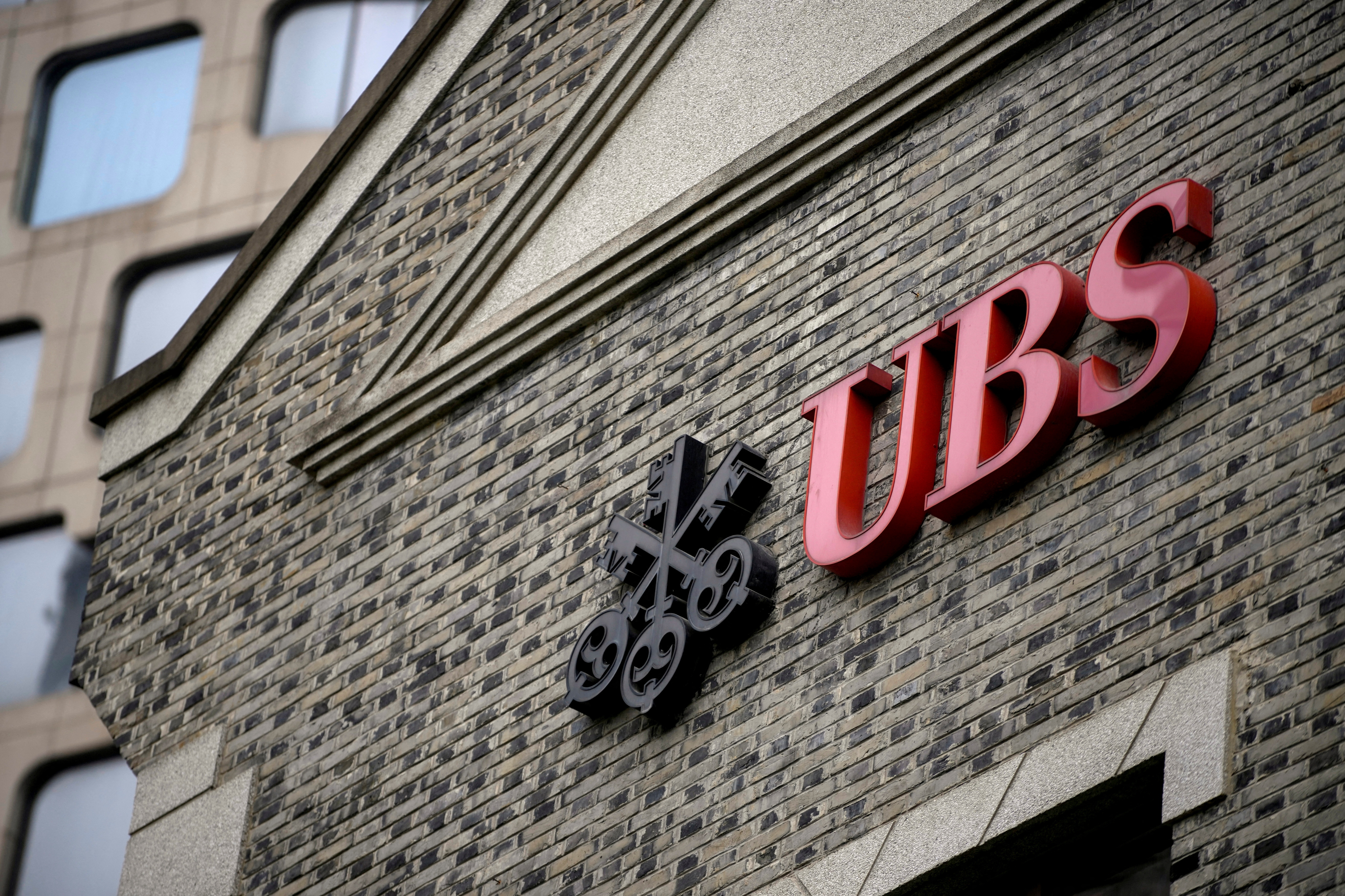 The logo of Swiss bank UBS is seen at the bank's branch in Shanghai