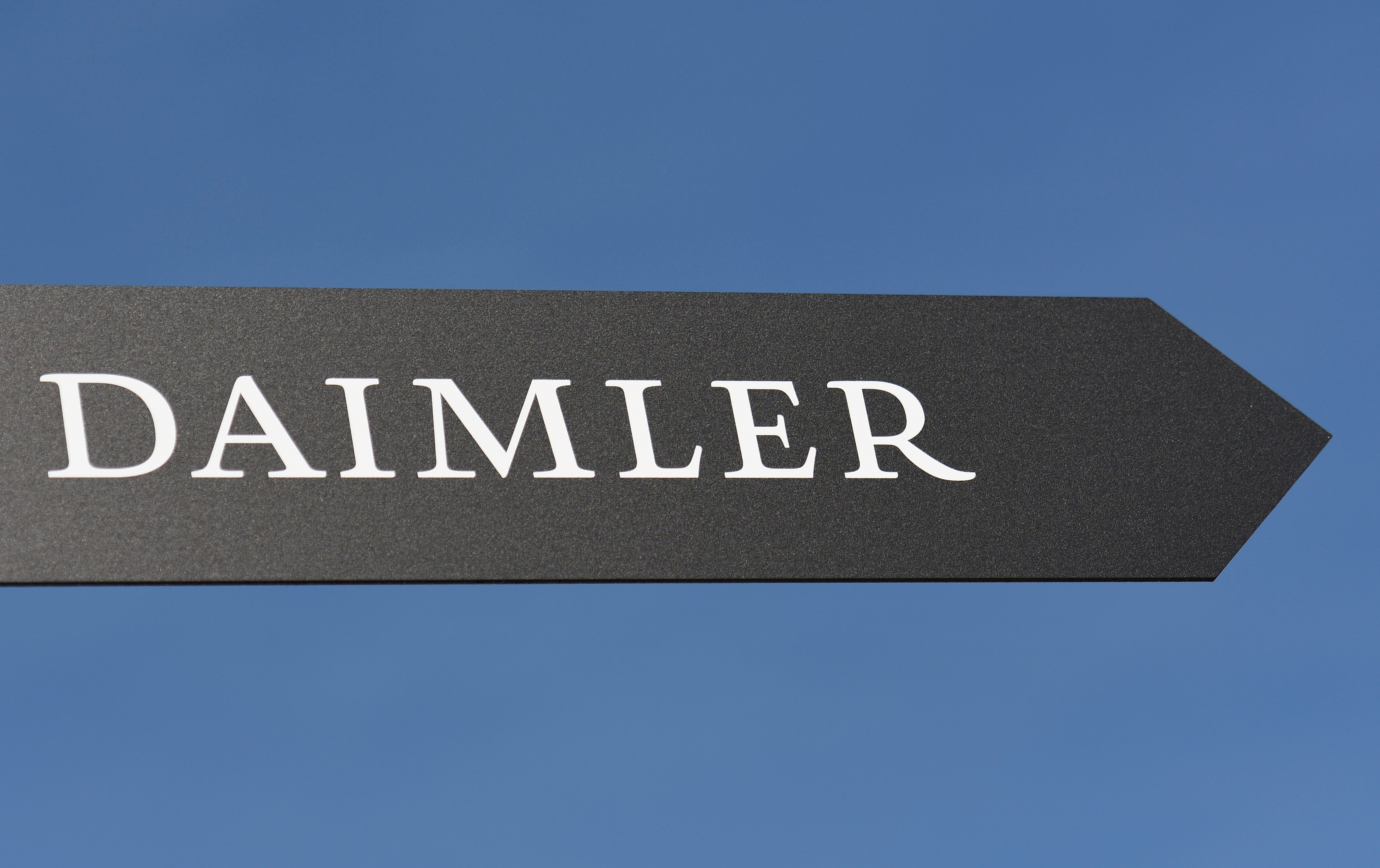 Daimler AG sign is pictured at the IAA truck show in Hanover