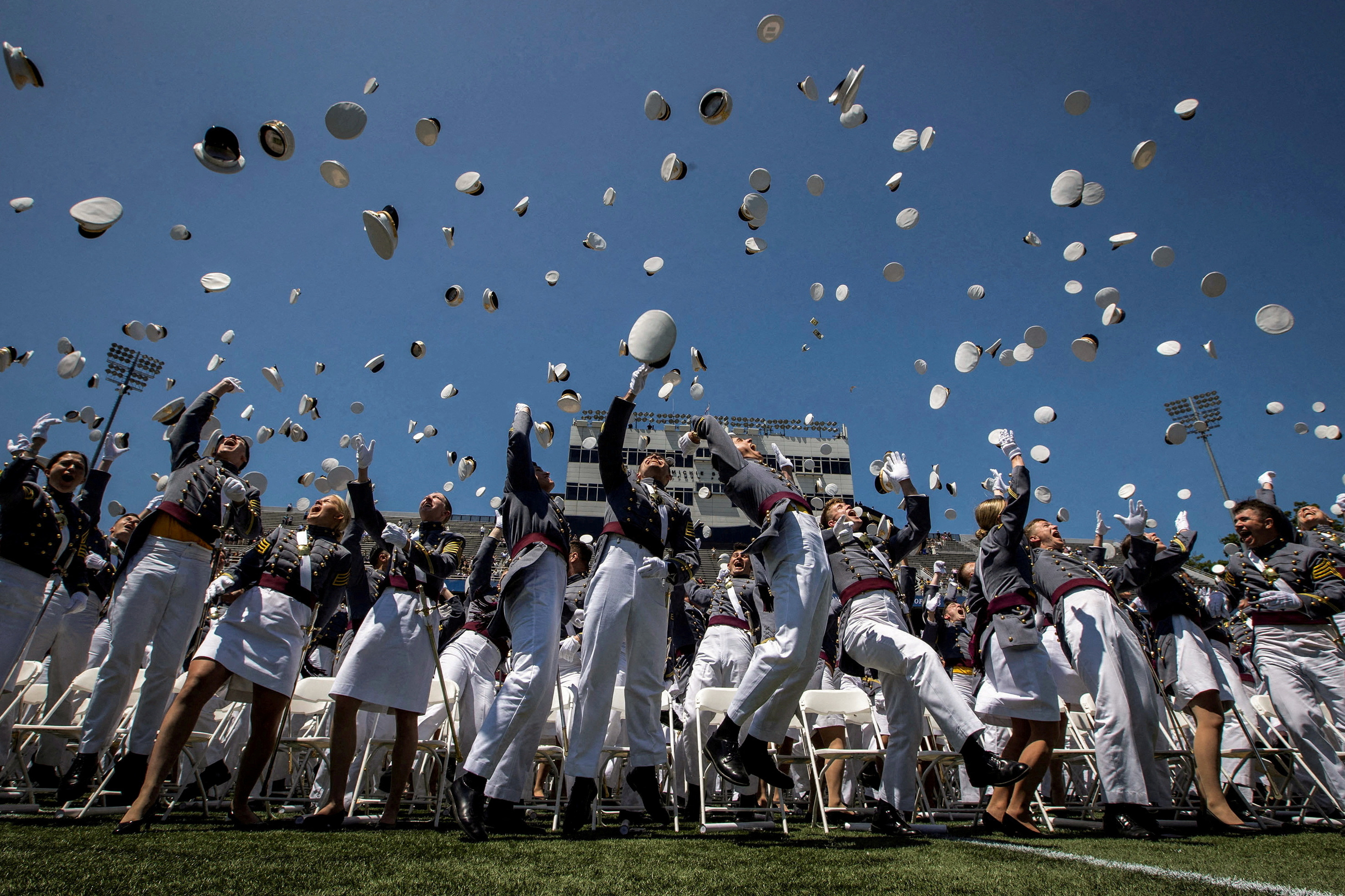 Graduating cadets toss their hats into the air at the end of the 2023 graduation ceremony at the United States Military Academy at West Point, New York.