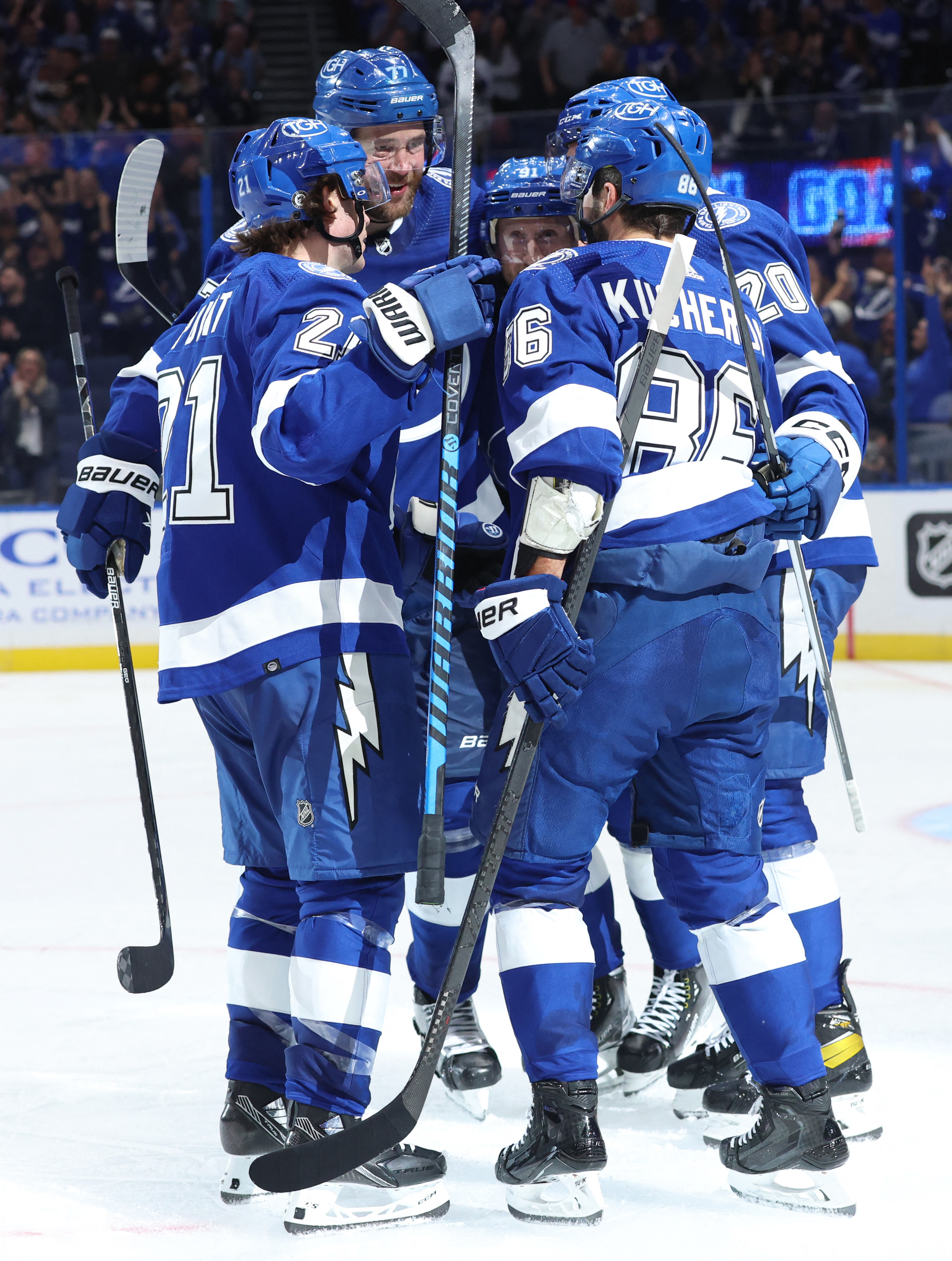 Tampa Bay Lightning center Michael Eyssimont (23) battles for the