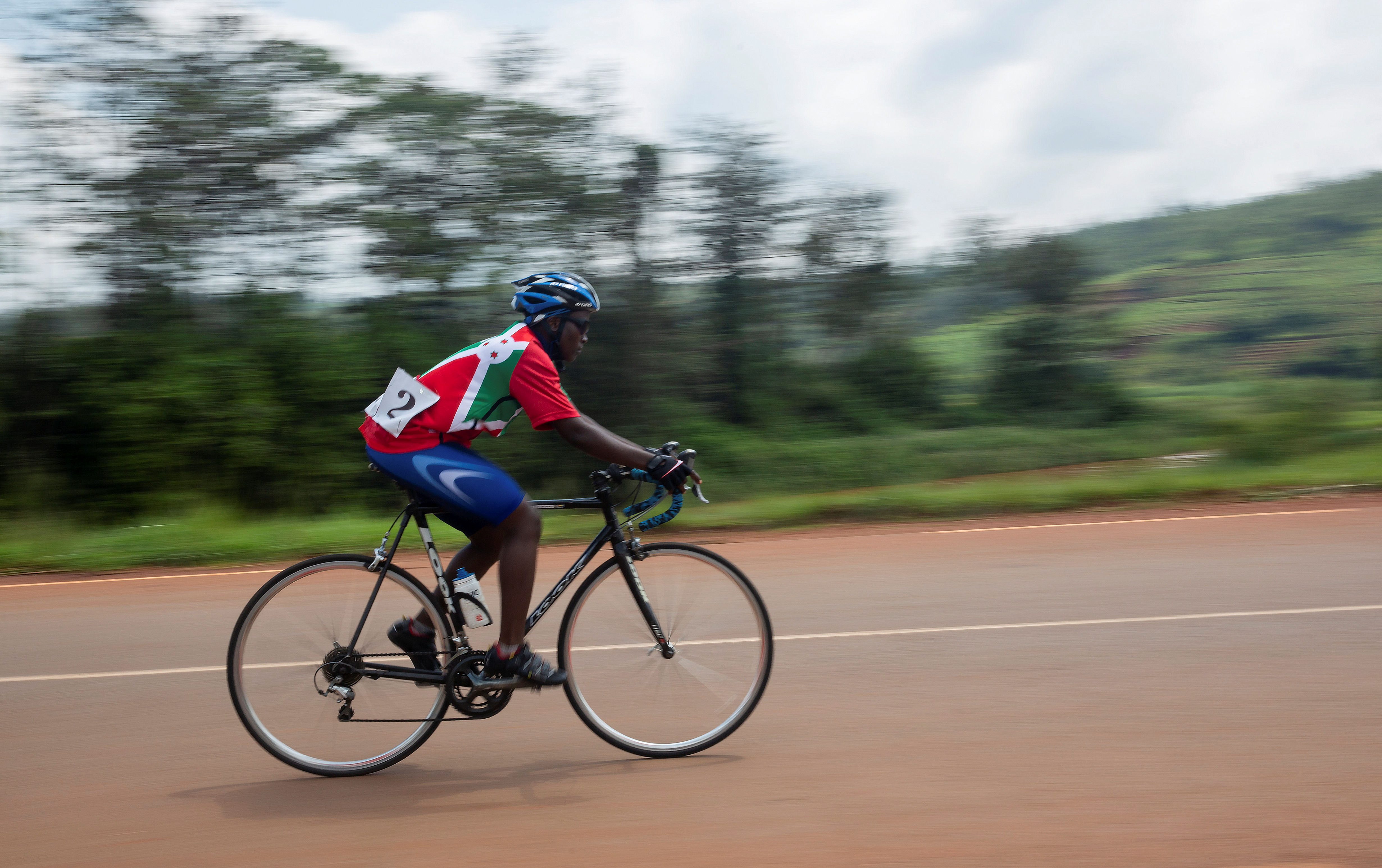 Delphine Nifasha, 19, a student and a member of Burundi women's cycling team leads the last race from Ngozi to Gitega during the first International Women's Cycling Tour in Ngozi, Burundi November 28, 2021. REUTERS/Evrard Ngendakumana