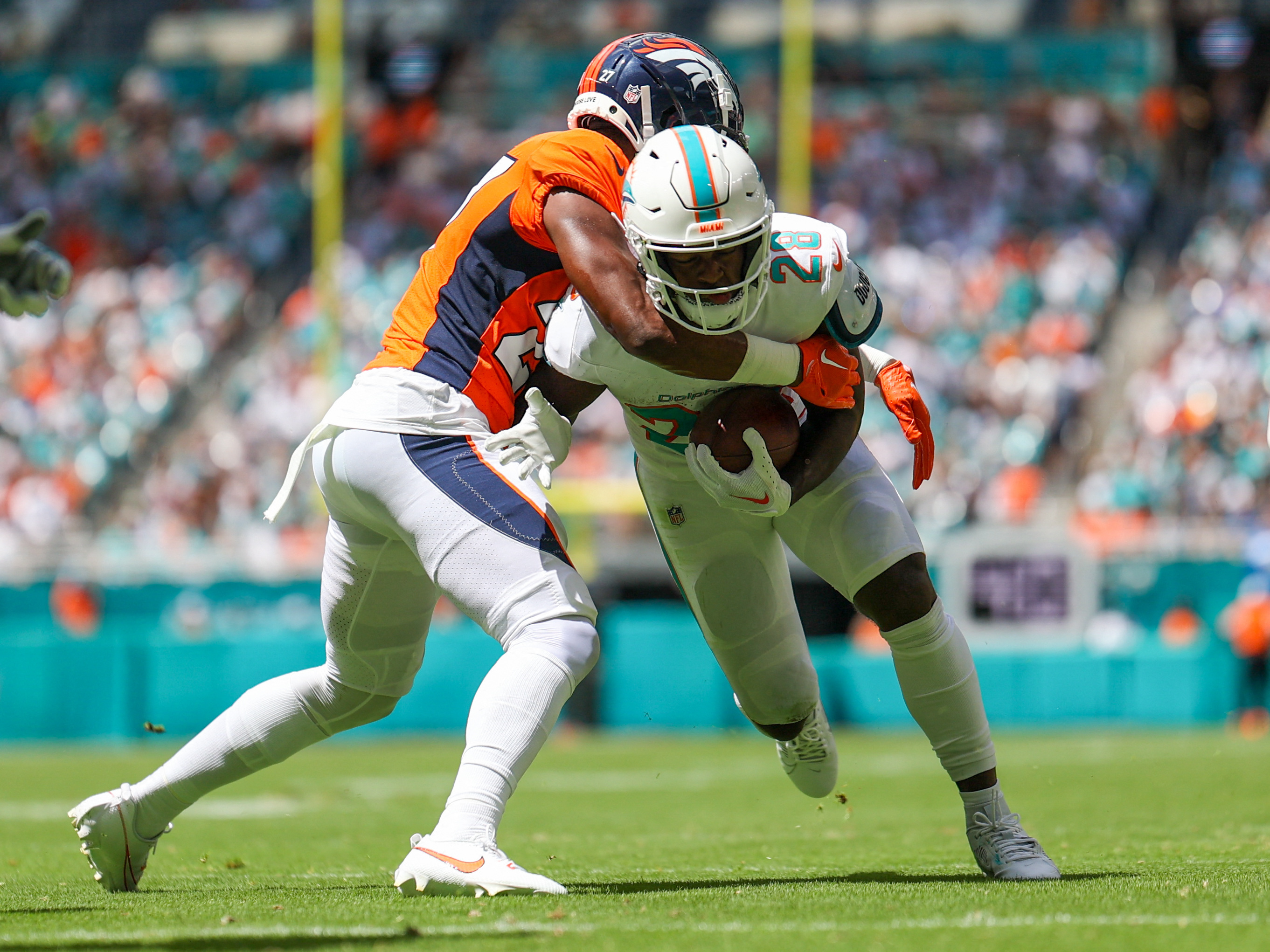 Dolphins pour it on with 70-20 rout over Broncos, Fieldlevel