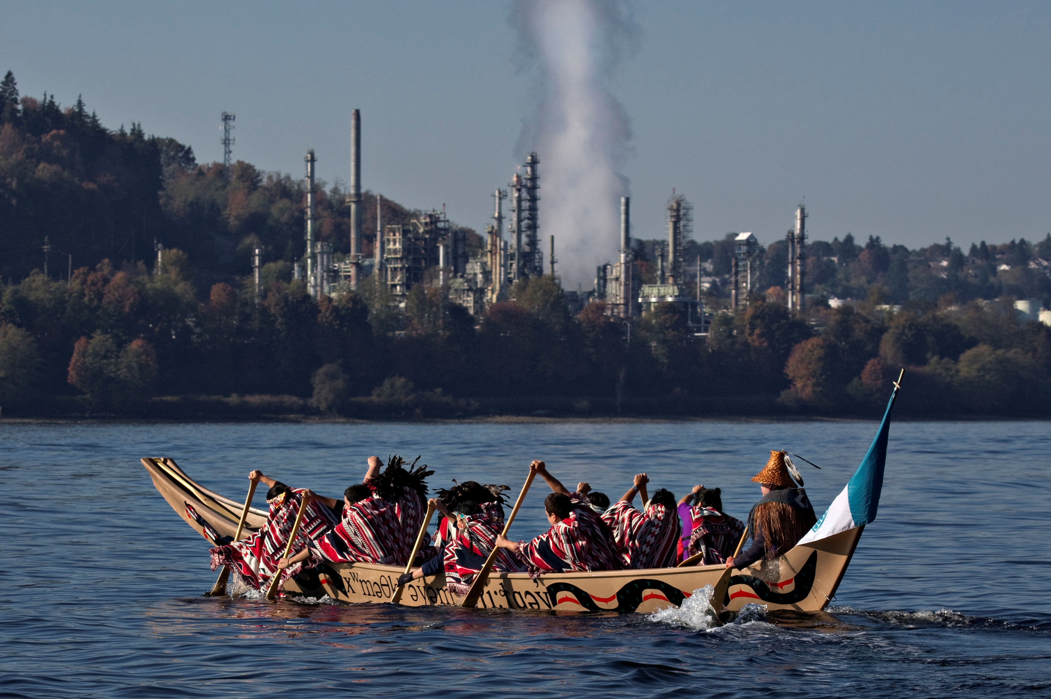 First Nation Tsleil-Waututh, Squamish and Musqueam bands paddle in a canoe during a protest in North Vancouver