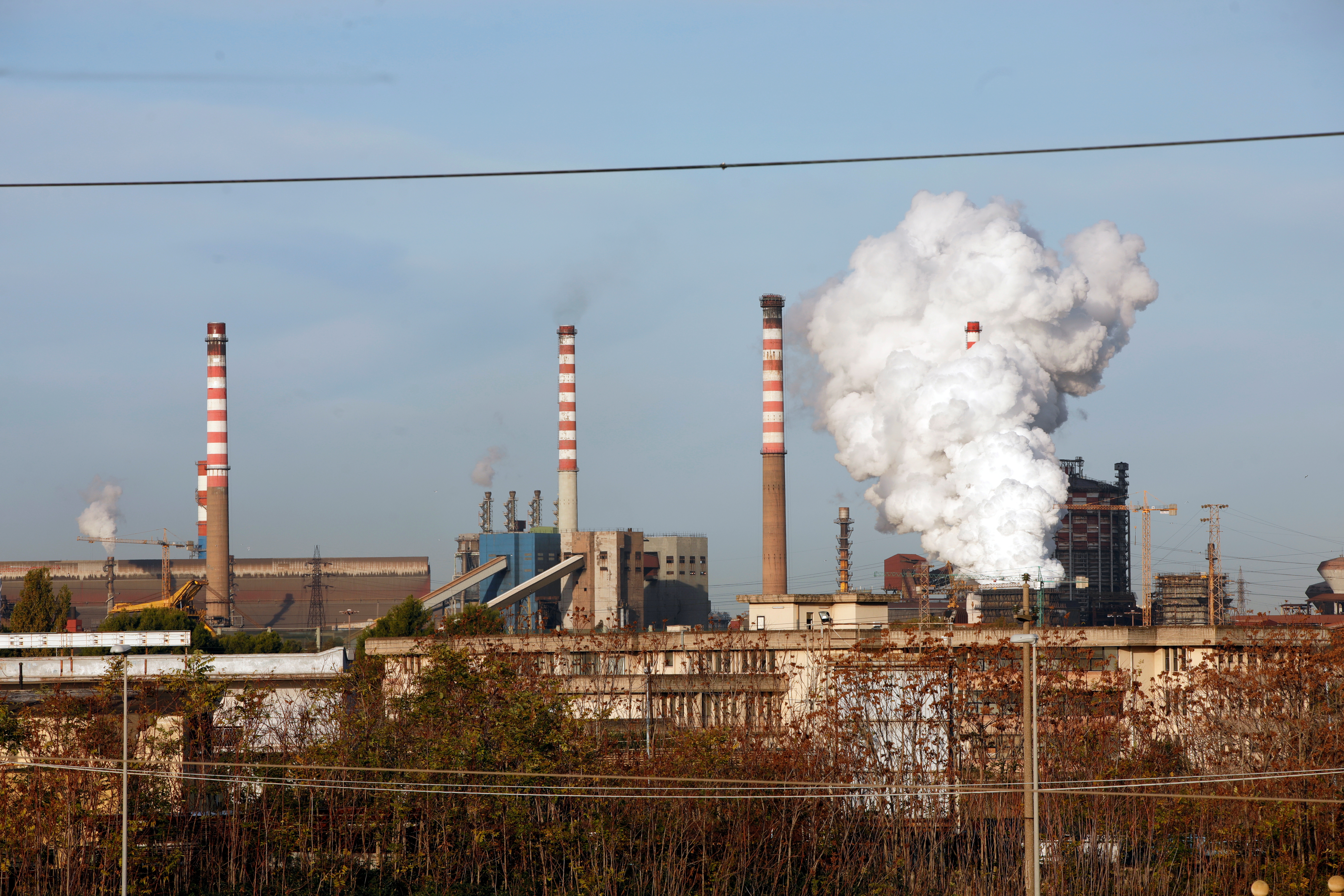 Steam comes out of the chimneys of the Ilva steel plant in Taranto