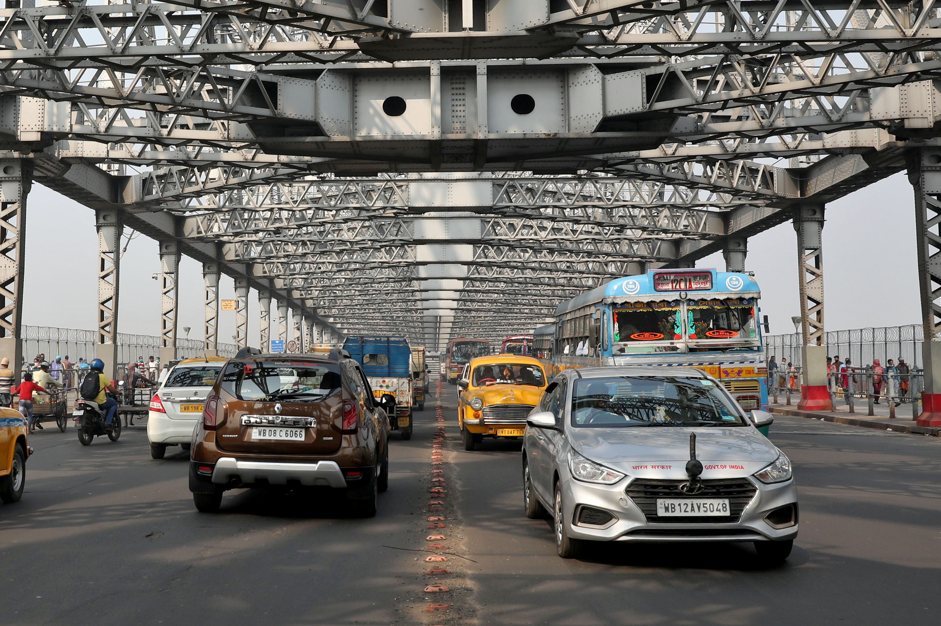 A general view shows vehicles crossing Howrah bridge in Kolkata