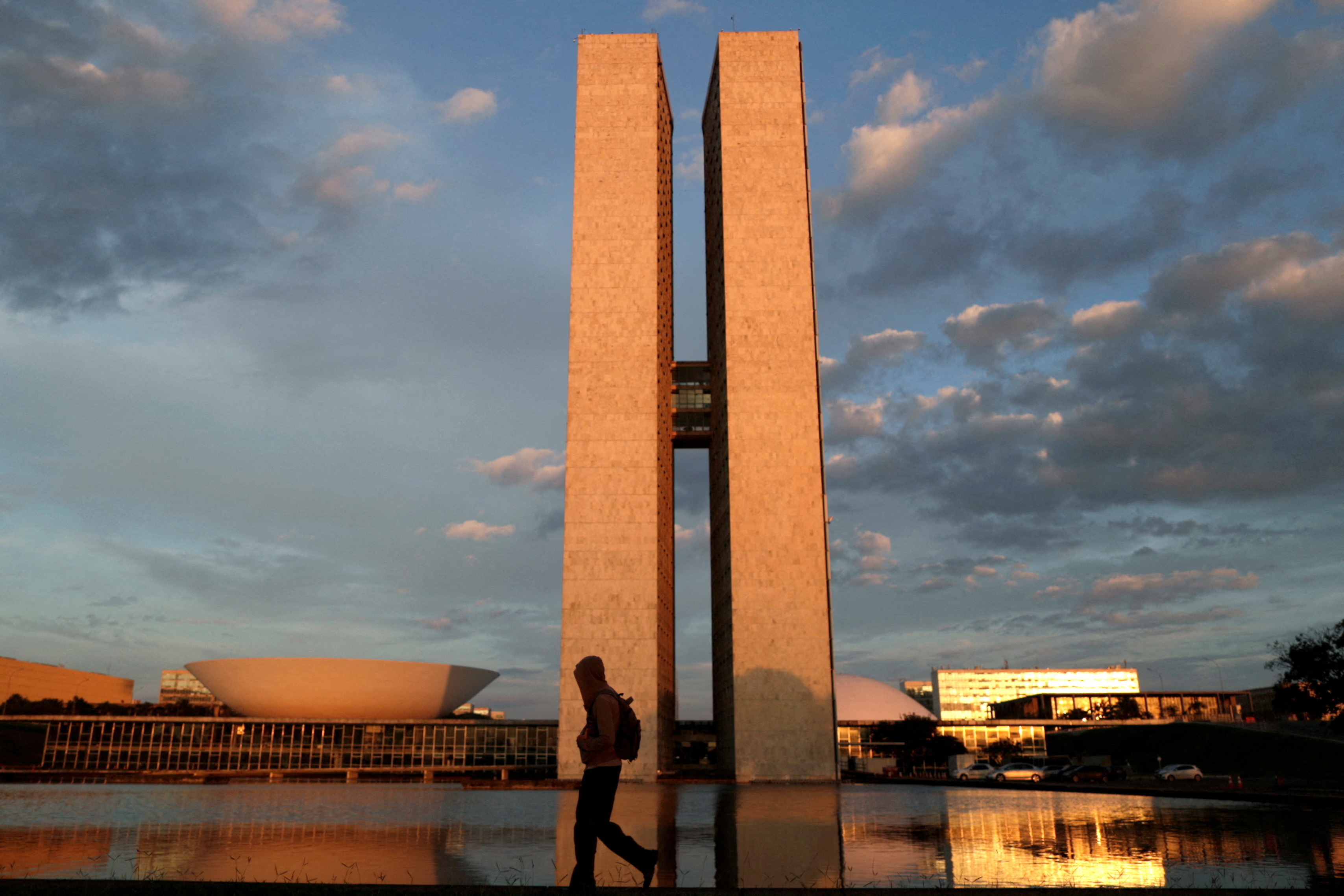 A man walks near the National Congress building, amid the coronavirus disease (COVID-19) outbreak, in Brasilia