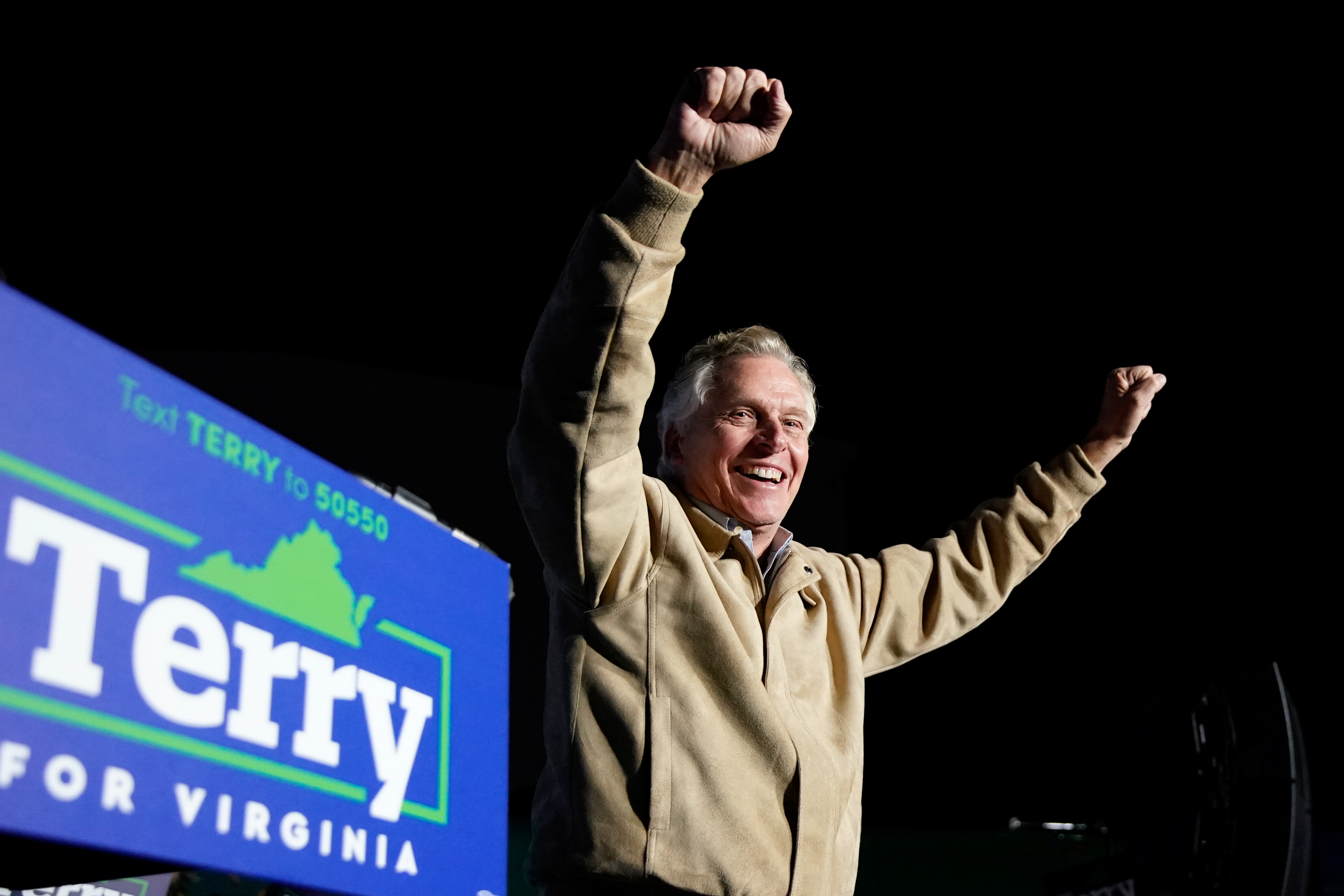 Virginia Democratic gubernatorial nominee and former governor Terry McAuliffe takes the stage during a campaign event at Caboose Commons in Fairfax, Virginia, U.S., November 1, 2021. REUTERS/Elizabeth Frantz